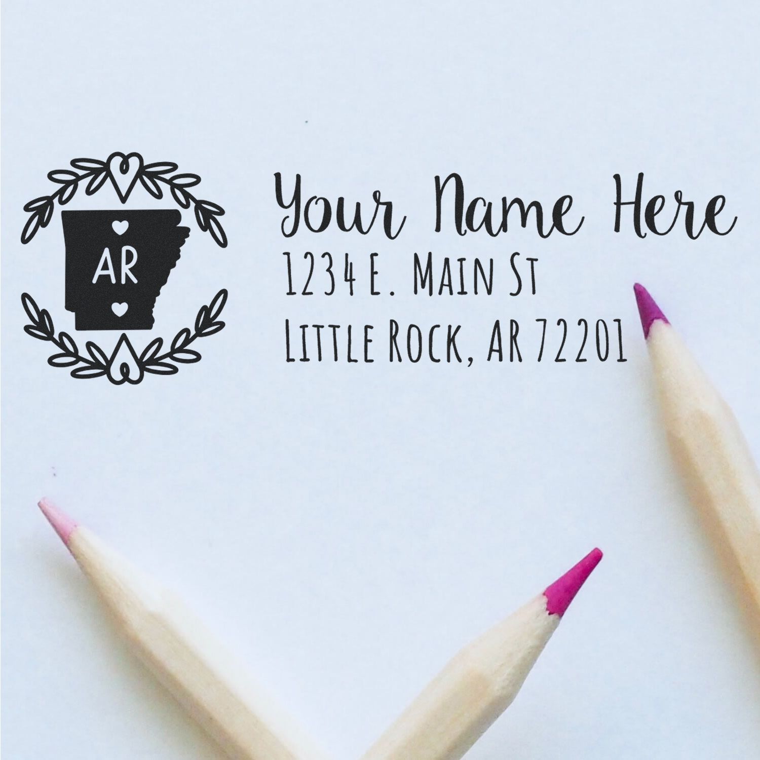 Personalized Arkansas return address rubber stamp with name and Little Rock, AR 72201, featuring state and laurel design.