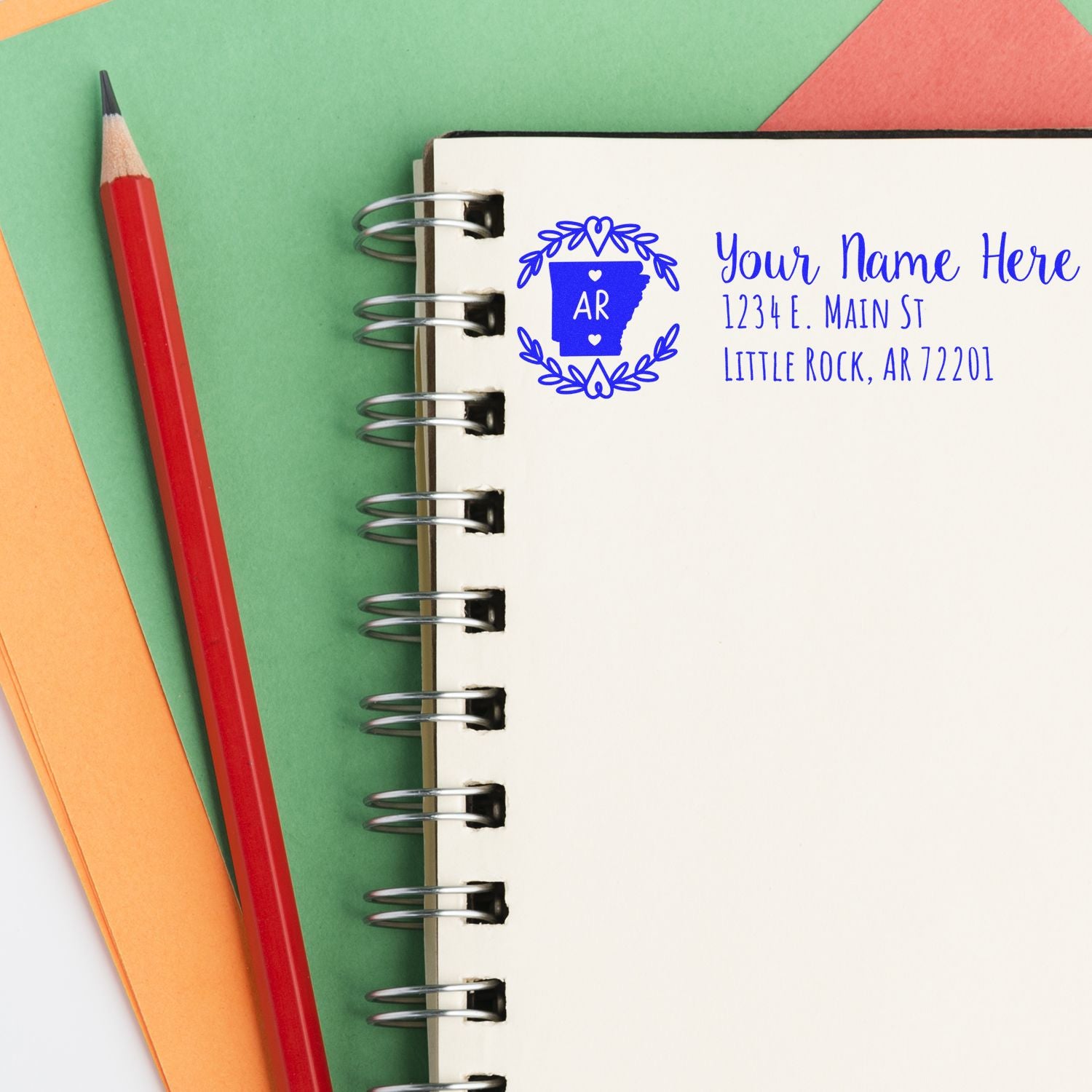 Personalized Arkansas return address rubber stamp imprint on notebook, with name and Little Rock, AR address.