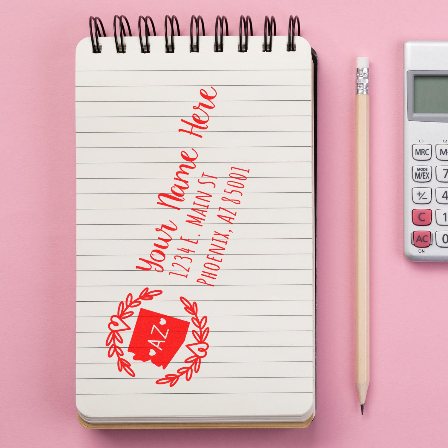 Custom address rubber stamp impression on notebook, ideal for return addresses on mail, cards, and packaging.
