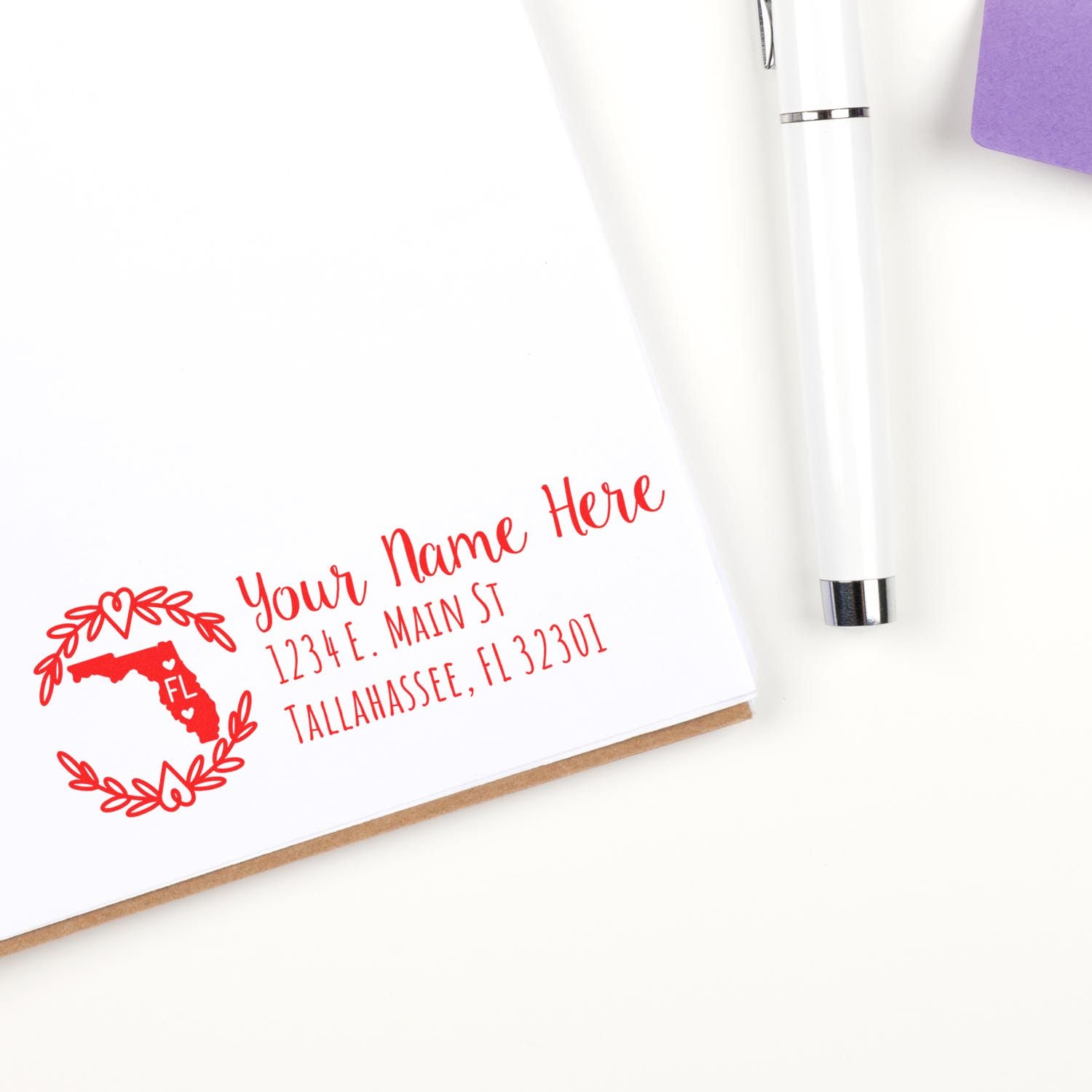 Custom Florida return address rubber stamp on envelope with name, street address, and Tallahassee, FL.