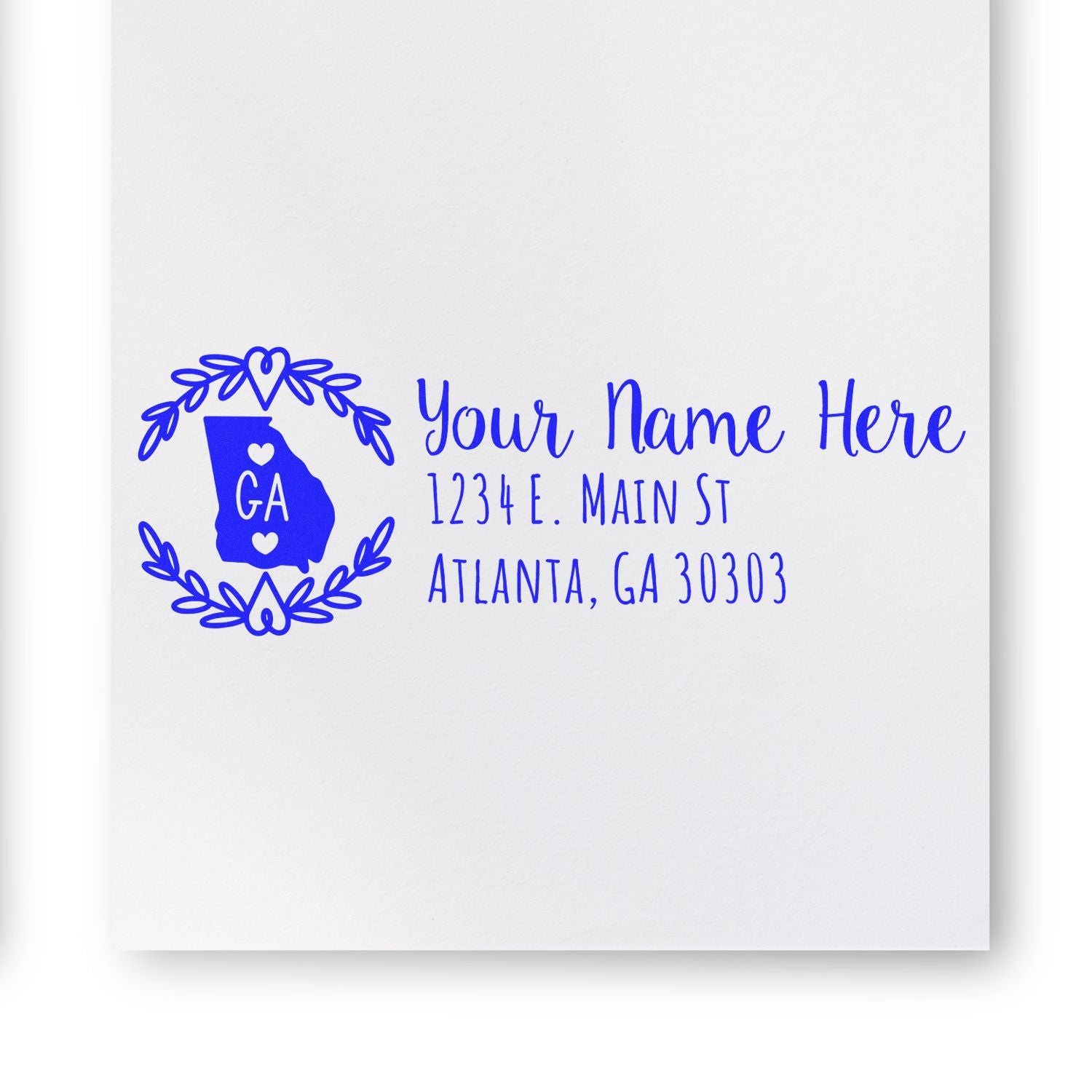 Custom Georgia address rubber stamp with name and Atlanta, GA return address in blue floral wreath design.