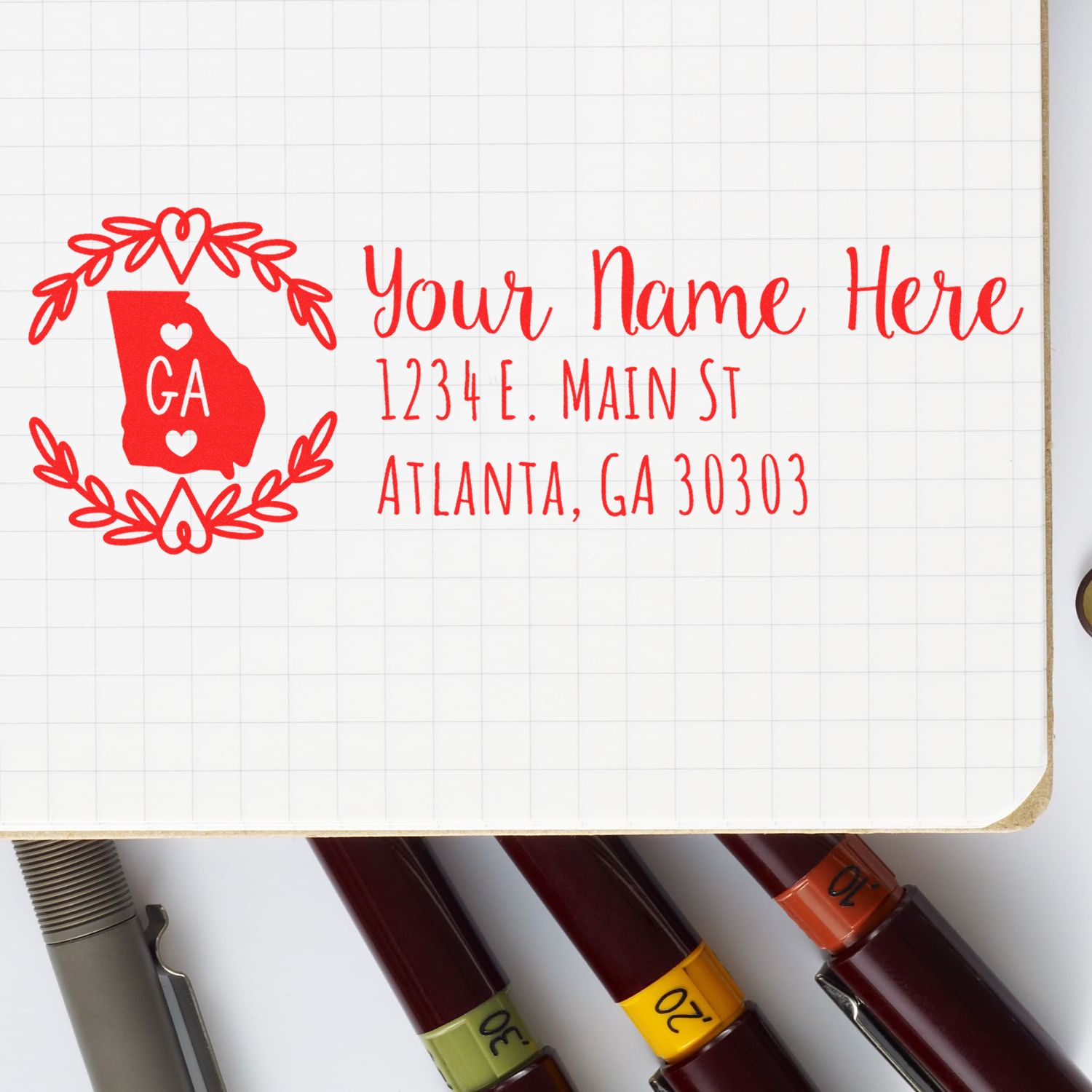 Custom Georgia address rubber stamp design with name, Atlanta mailing address, and heart wreath for envelopes.