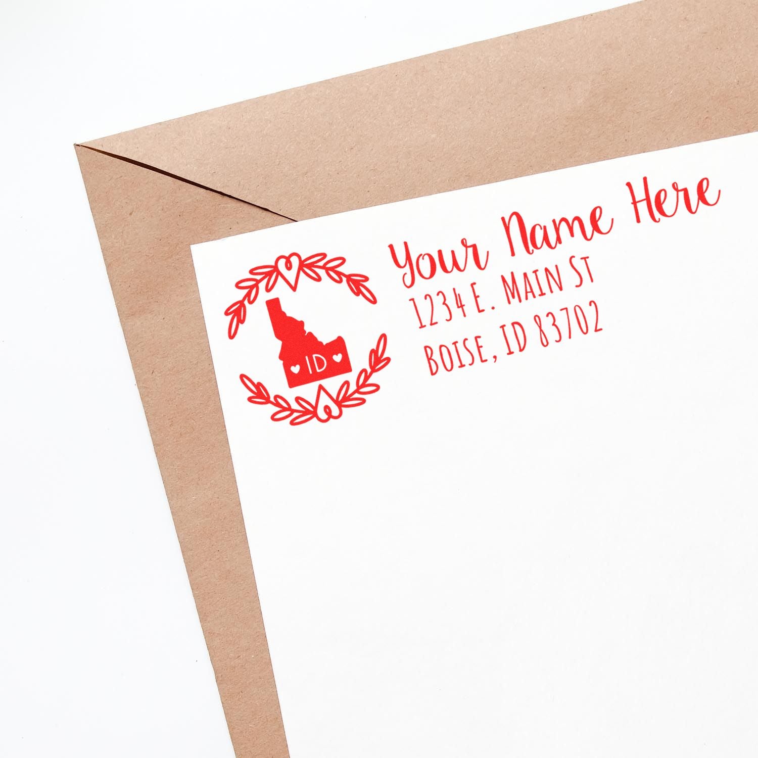 Personalized return address rubber stamp with Idaho design for envelopes, cards, and stationery.