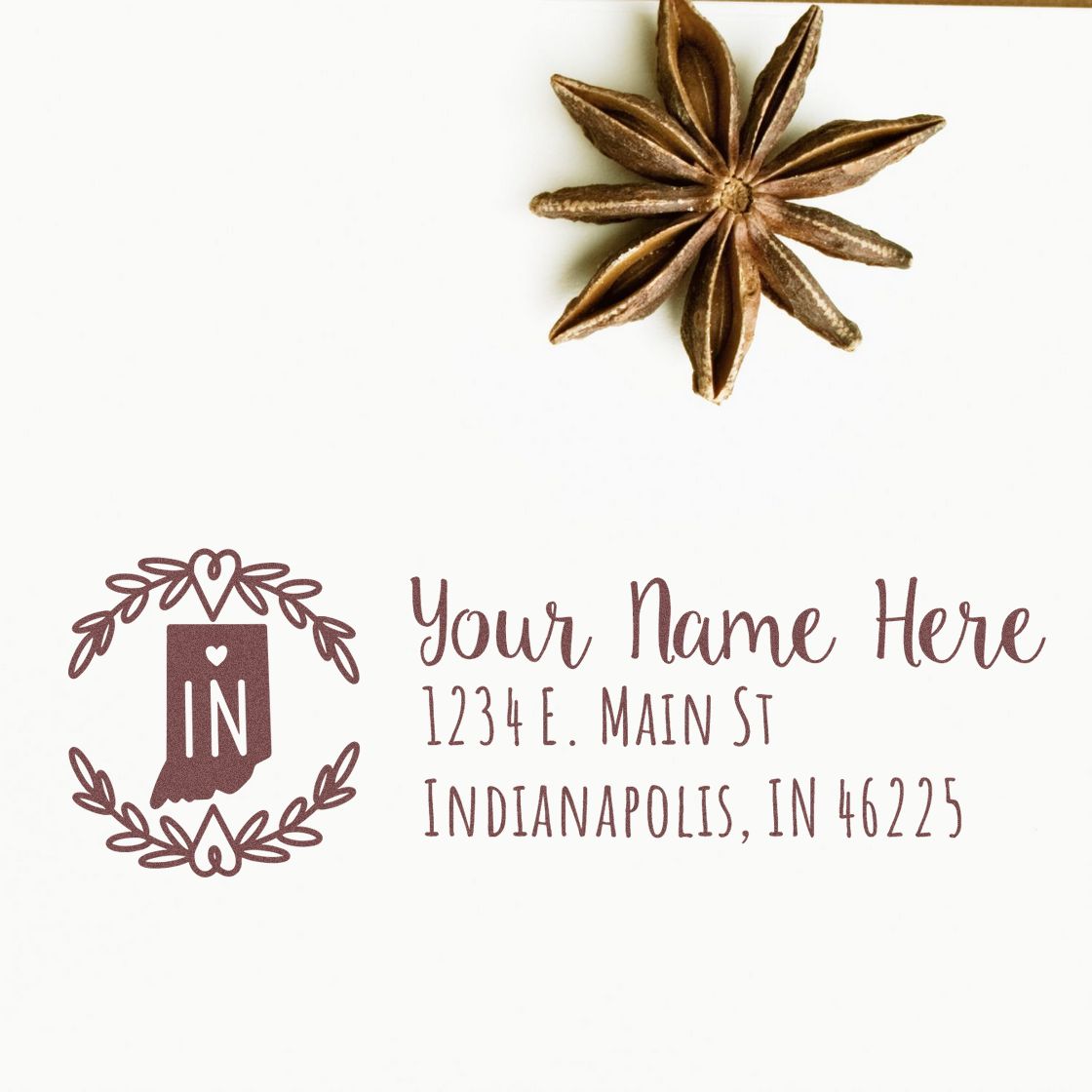Custom Indiana return address rubber stamp with wreath and heart design, featuring personalized name and address example.