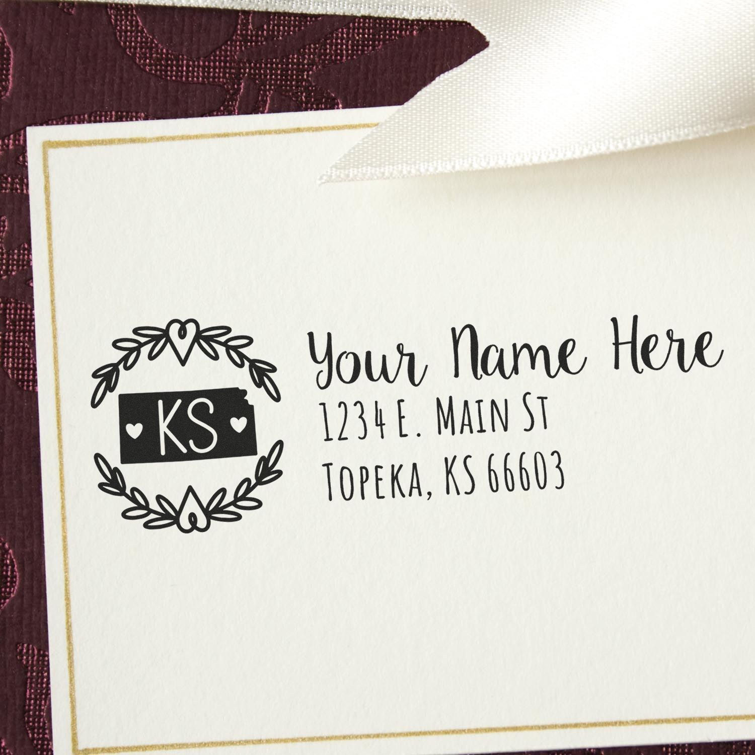 Custom return address rubber stamp with initials KS, decorative wreath design, and personalized name and address