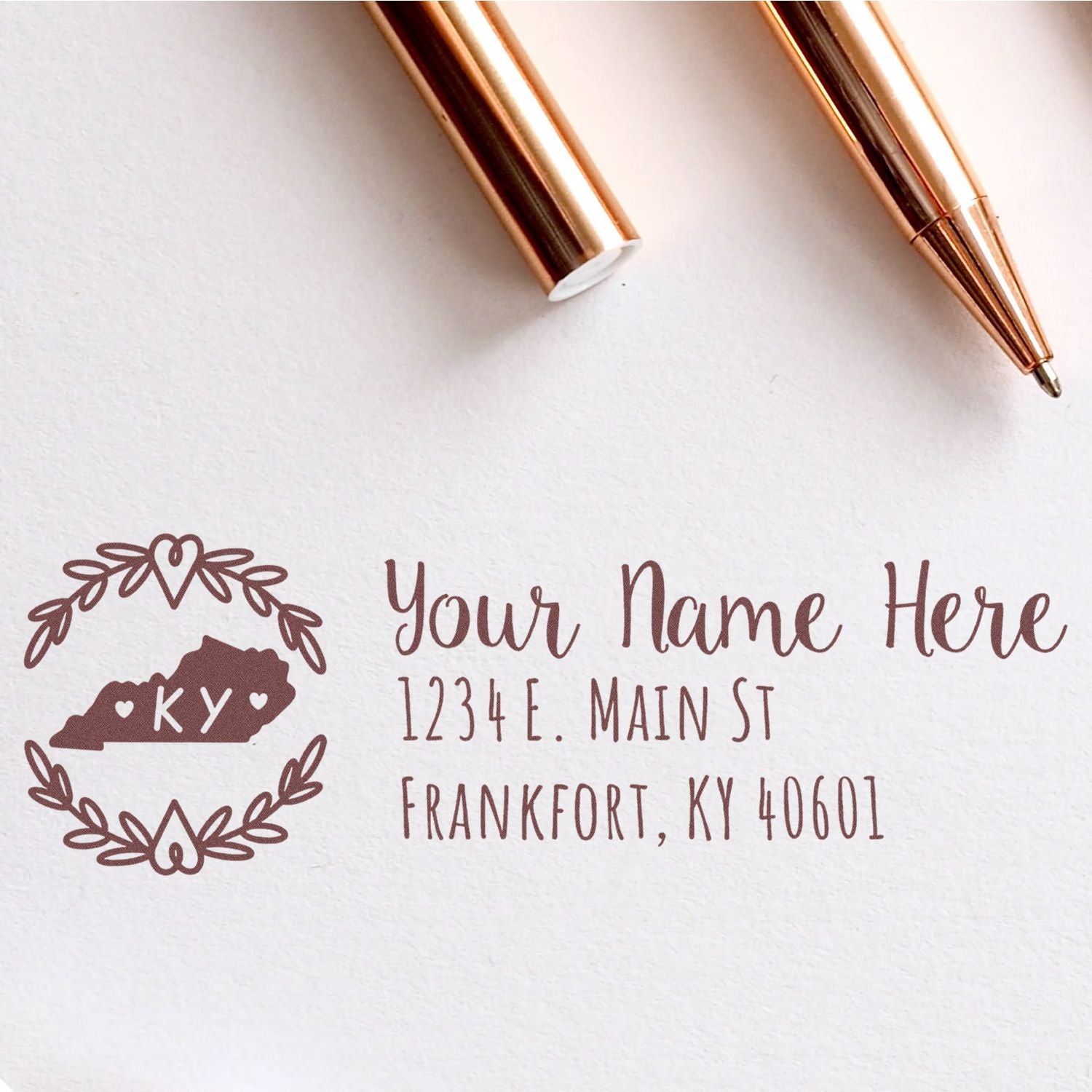 Custom address rubber stamp with Kentucky monogram wreath, personalized name, street address, and ZIP code.