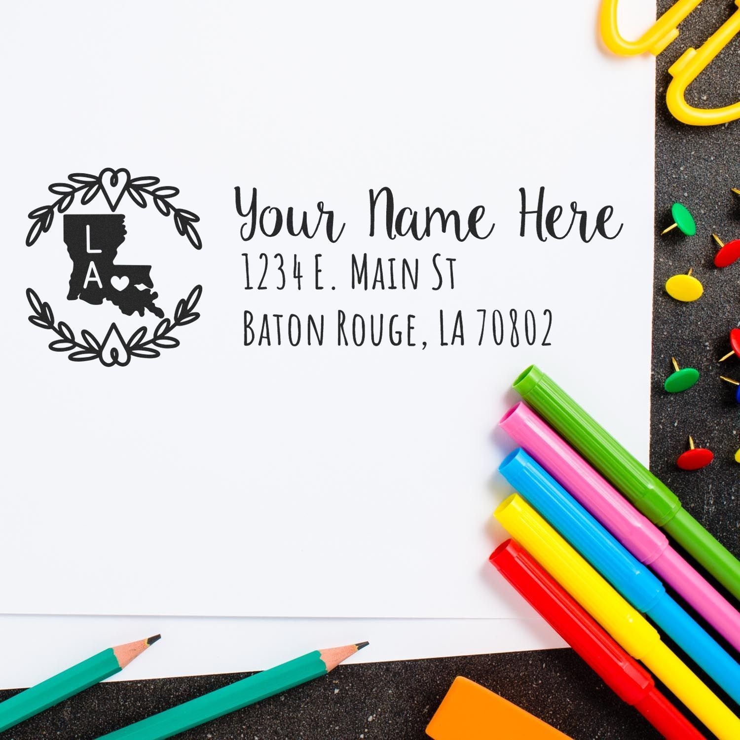 Custom Louisiana address rubber stamp with name and Baton Rouge address for personalized stationery and cards.