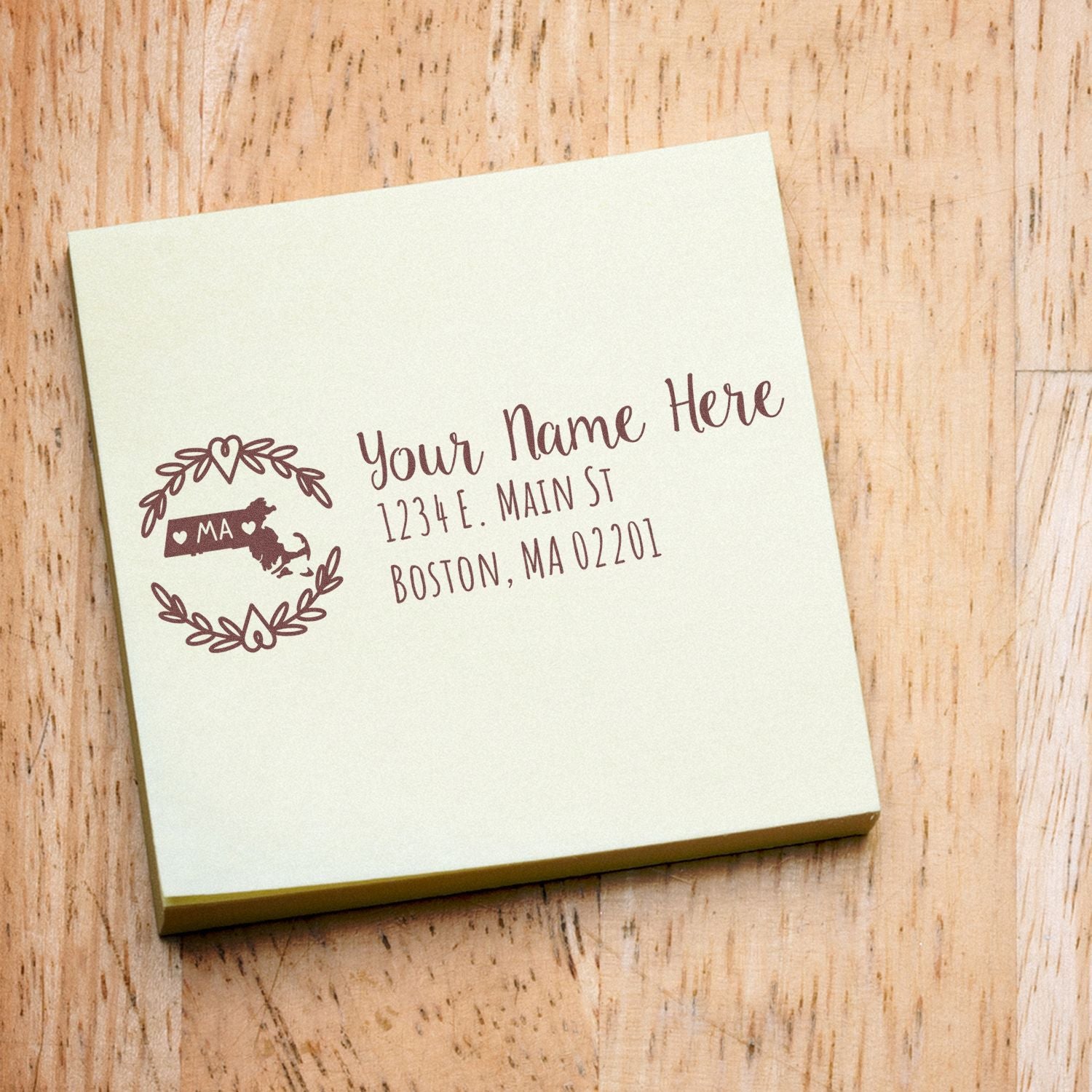 Custom return address rubber stamp with Massachusetts state design, floral wreath, and personalized name and mailing address.