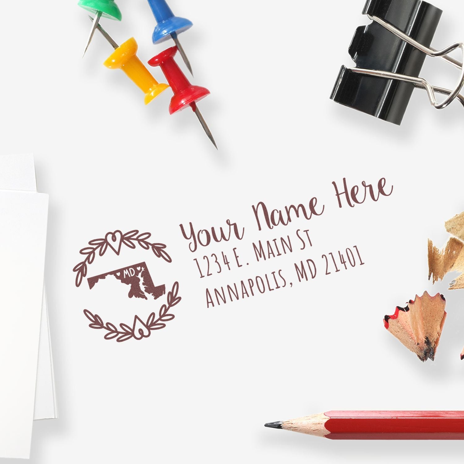 Custom return address rubber stamp with Maryland design on stationery, ideal for envelopes, mail, and small business branding.