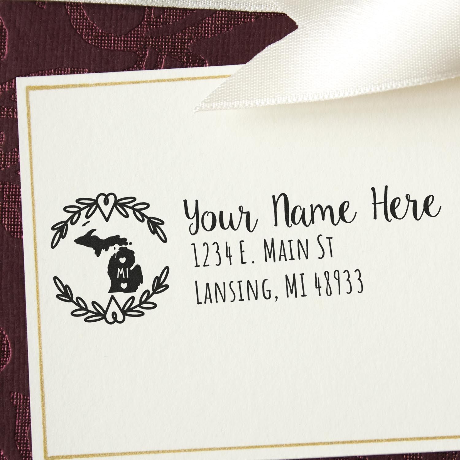 Custom Michigan return address rubber stamp with floral wreath and personalized name, street address, and ZIP code.