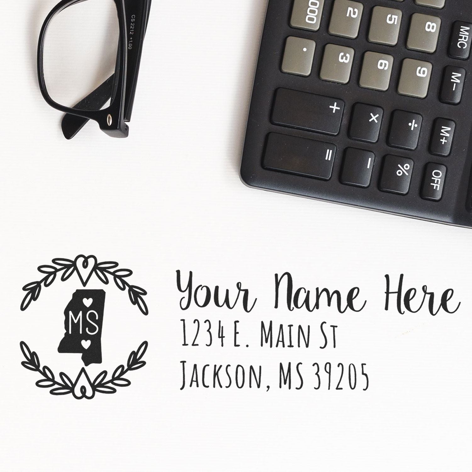 Custom return address rubber stamp with Mississippi state monogram, name, street address, and ZIP code for envelopes.