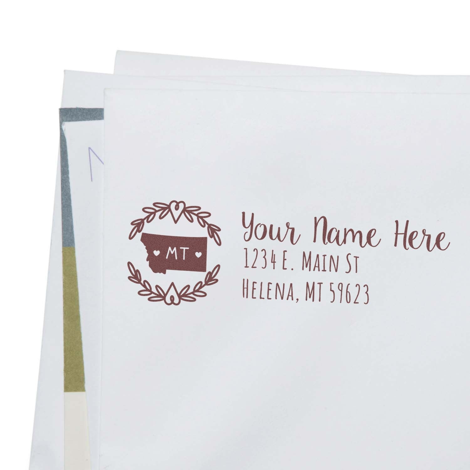 Custom Montana return address rubber stamp for wedding invitations, featuring floral wreath and personalized name and address.