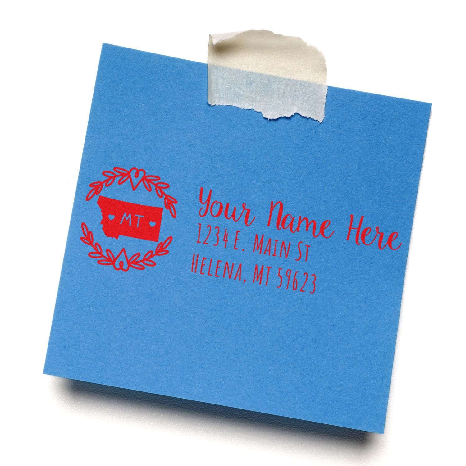 Custom return address rubber stamp on blue envelope, featuring a personalized Montana name and address design.