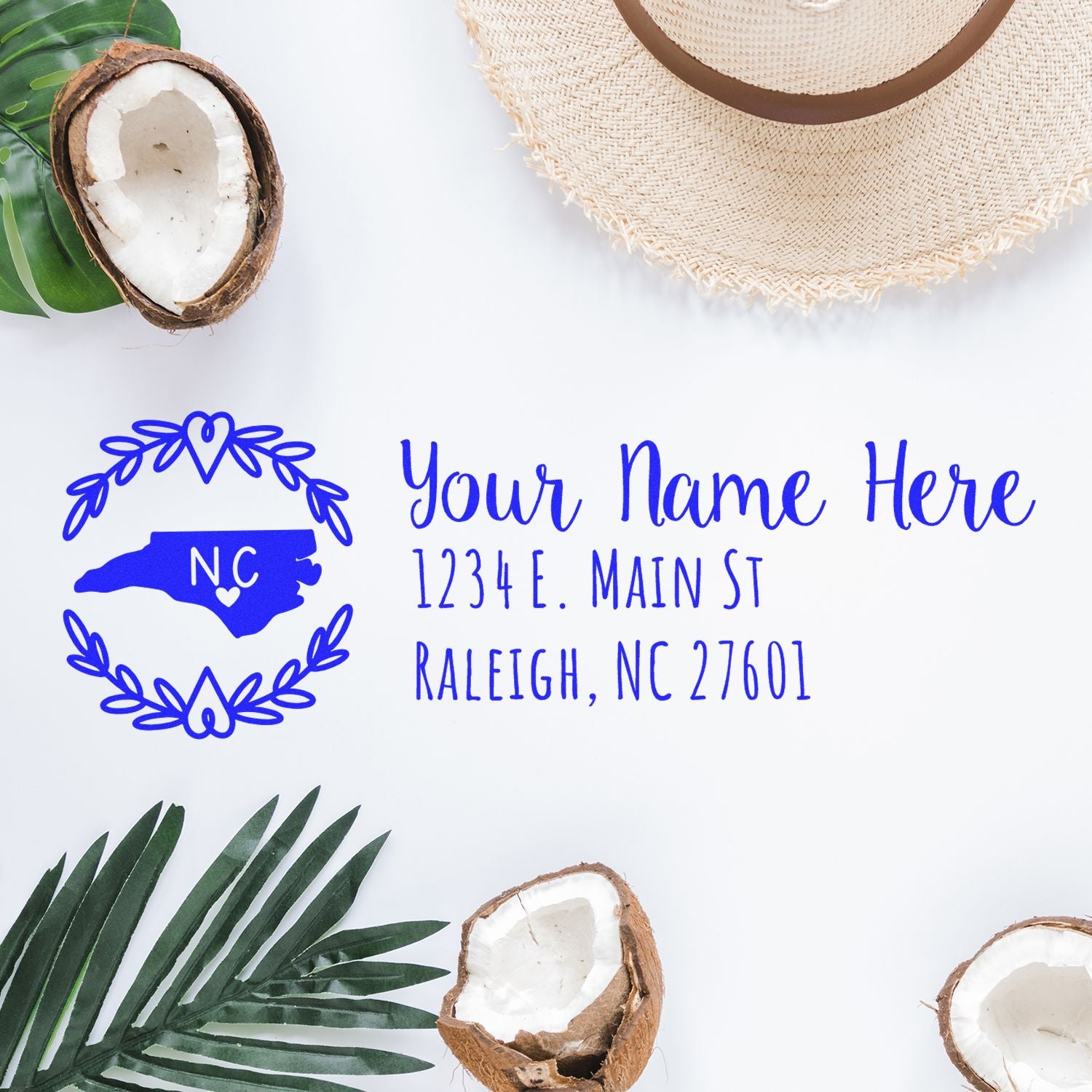 Custom North Carolina return address rubber stamp with floral wreath and name, street address, and Raleigh, NC ZIP code.