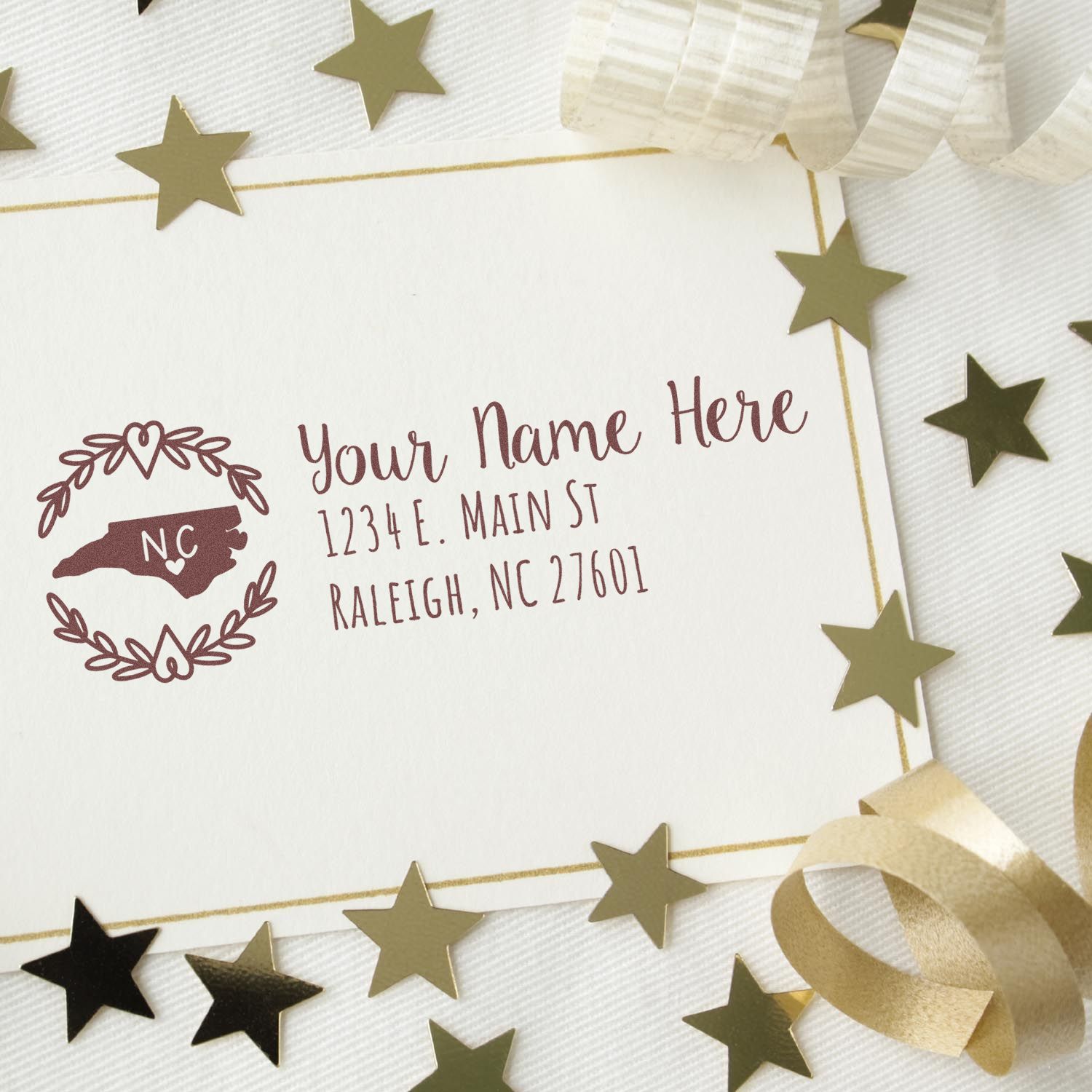Personalized return address rubber stamp for wedding stationery with North Carolina monogram and floral wreath design.