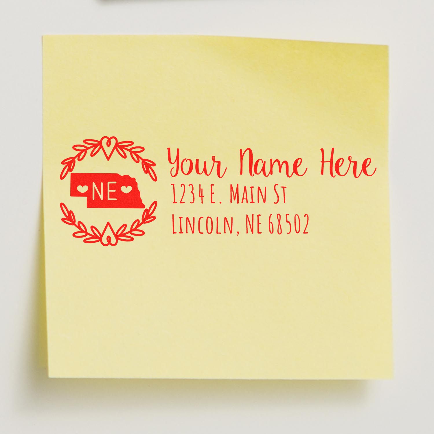Custom Nebraska return address rubber stamp with decorative heart wreath for personalized mailing labels and envelopes