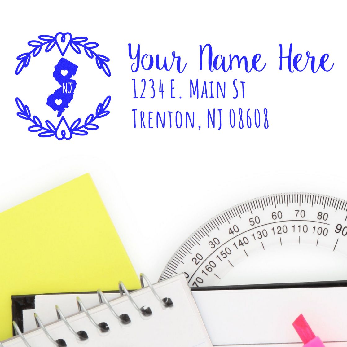 Personalized custom address rubber stamp with New Jersey name and address, shown with stationery and drafting tools.