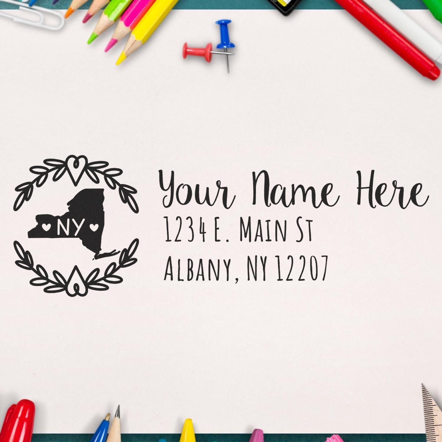 Custom rubber address stamp with New York state design and name, street, and city address for mailing envelopes.