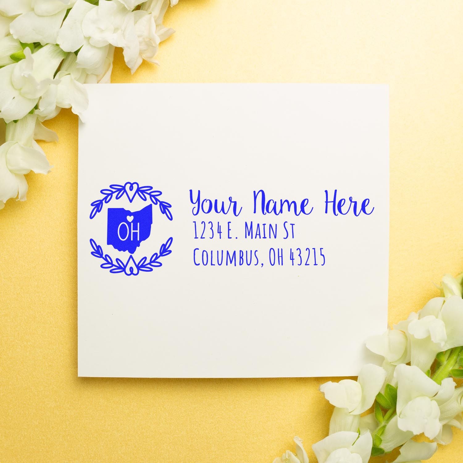 Custom Ohio return address rubber stamp with floral wreath, personalized name, street address, city, and ZIP code.
