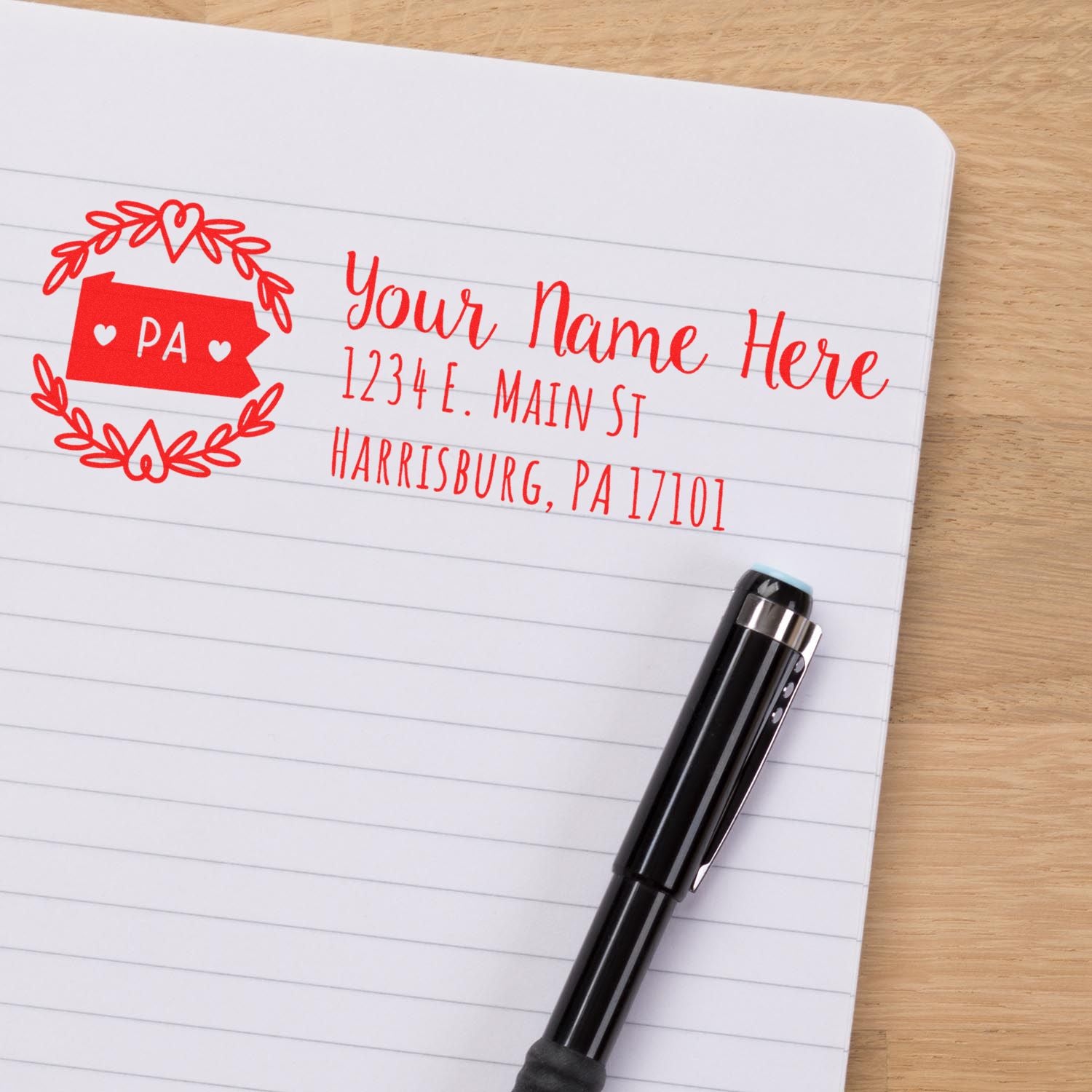 Custom rubber return address stamp with Pennsylvania heart wreath design, personalized name, street address, and ZIP code.