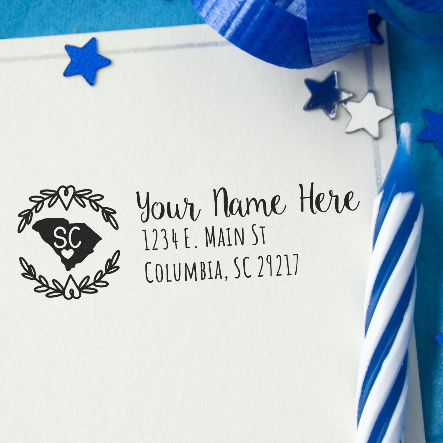 Custom rubber return address stamp with South Carolina monogram on envelope, ideal for personalized wedding stationery.