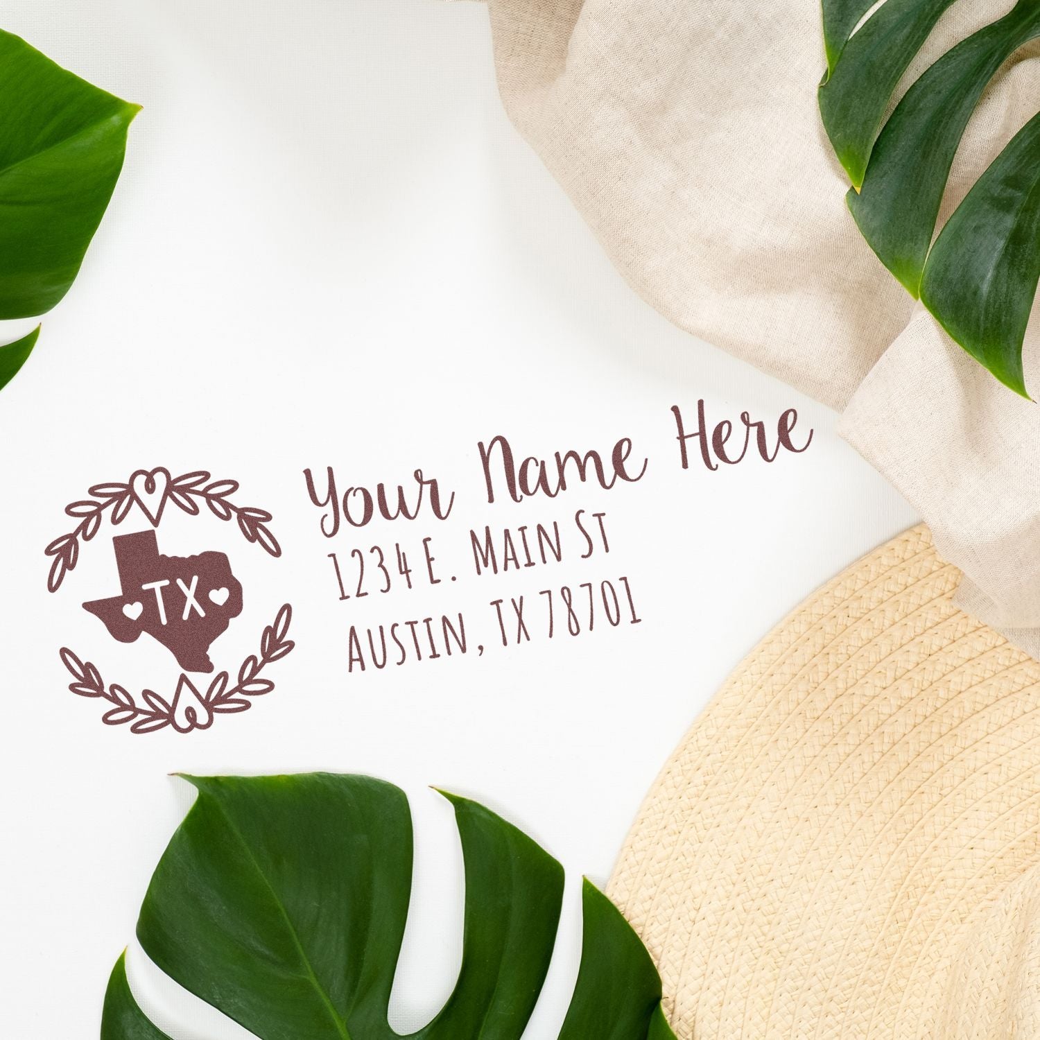 Custom Texas return address rubber stamp with floral wreath, name, and Austin address for personalized envelopes and mailings.
