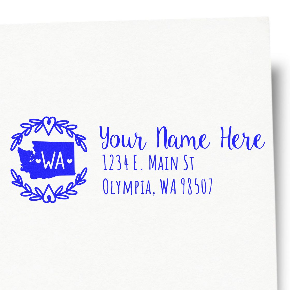 Custom Washington return address rubber stamp with state outline, floral wreath, name, and Olympia, WA address.