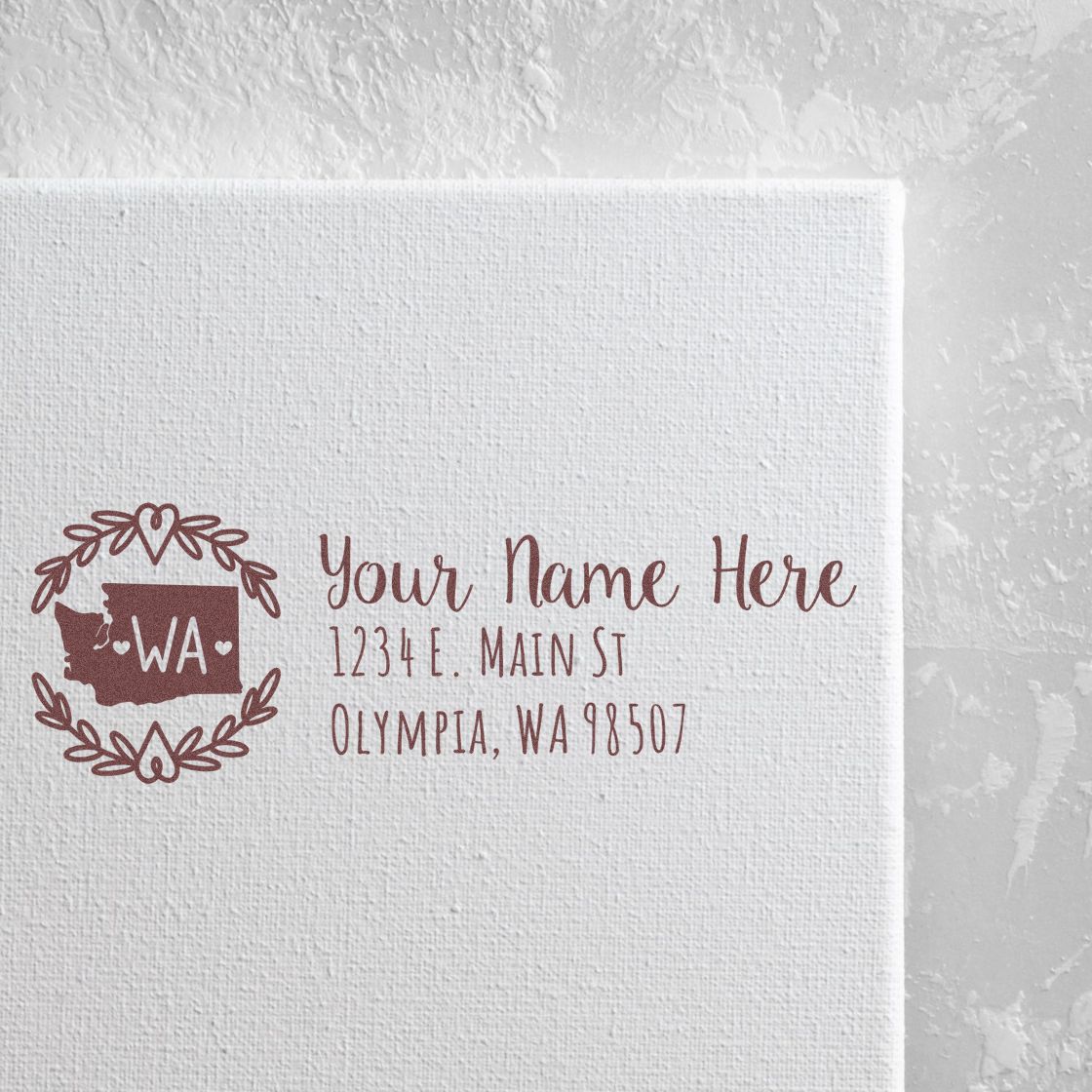 Custom return address rubber stamp with Washington state monogram and personalized name and address.