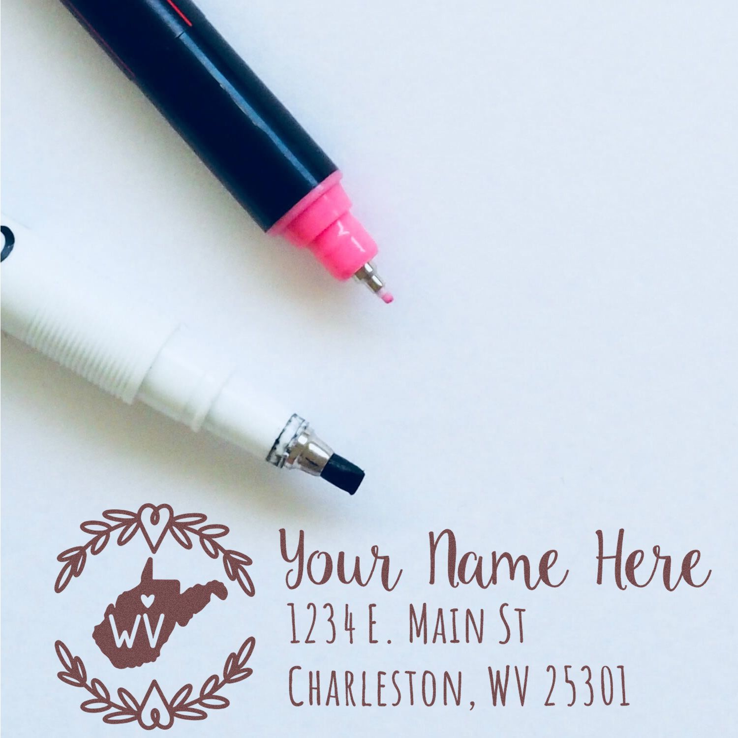 Custom West Virginia return address rubber stamp with personalized name, address, and state emblem design.