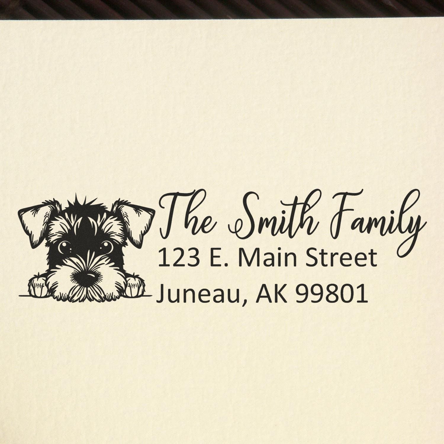 Personalized family address rubber stamp with dog illustration for The Smith Family, Juneau, AK 99801.