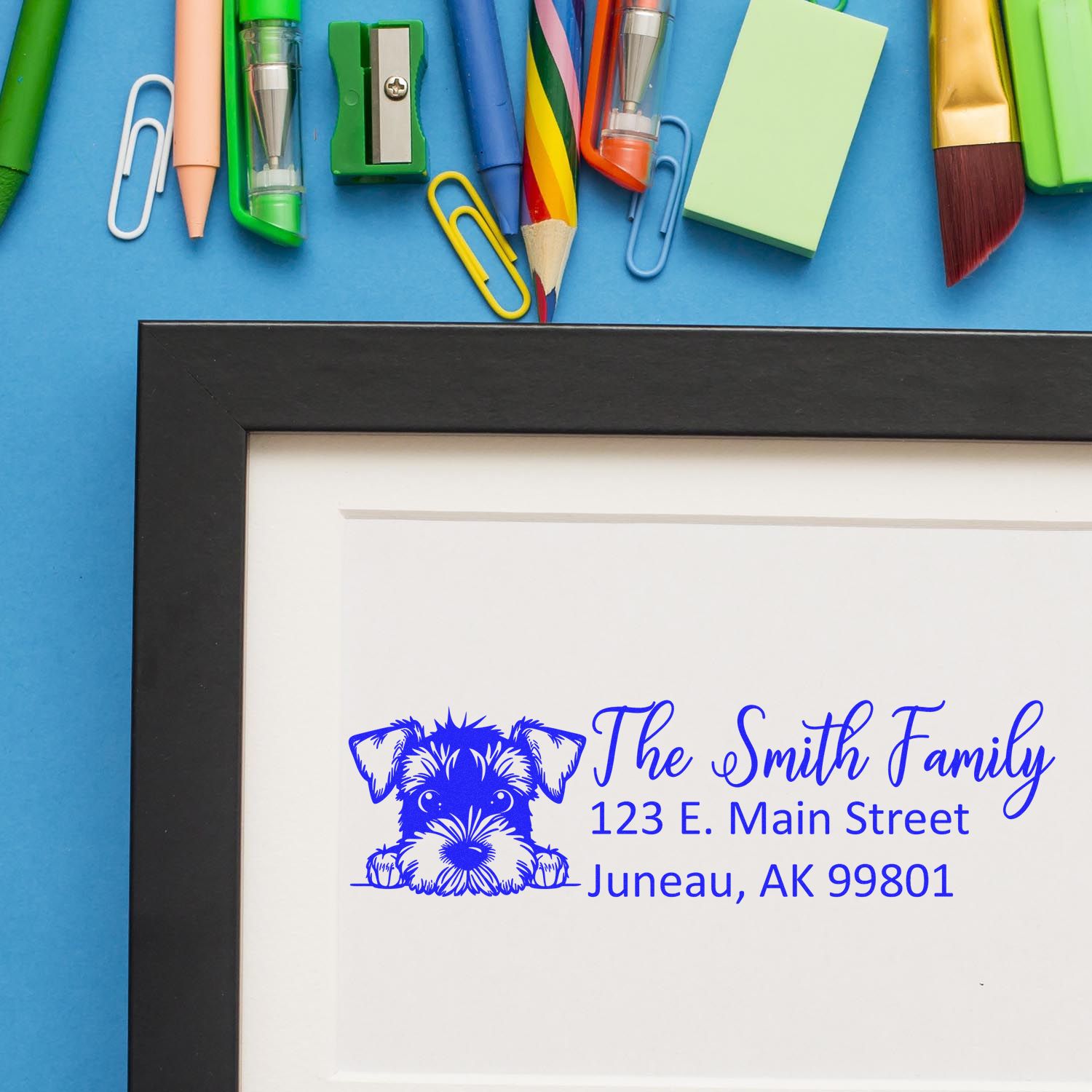 Custom return address rubber stamp with dog logo for The Smith Family, featuring personalized name and Juneau, AK address.