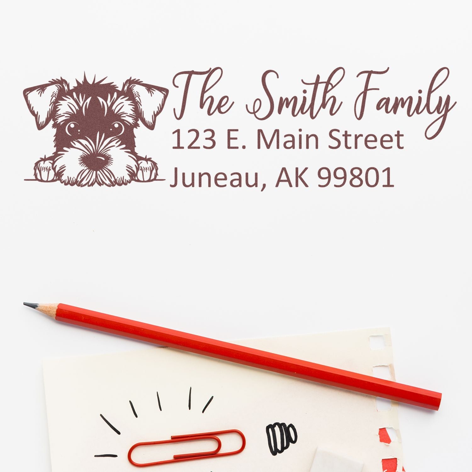 Custom return address rubber stamp with dog illustration for The Smith Family, 123 E. Main Street, Juneau, AK 99801