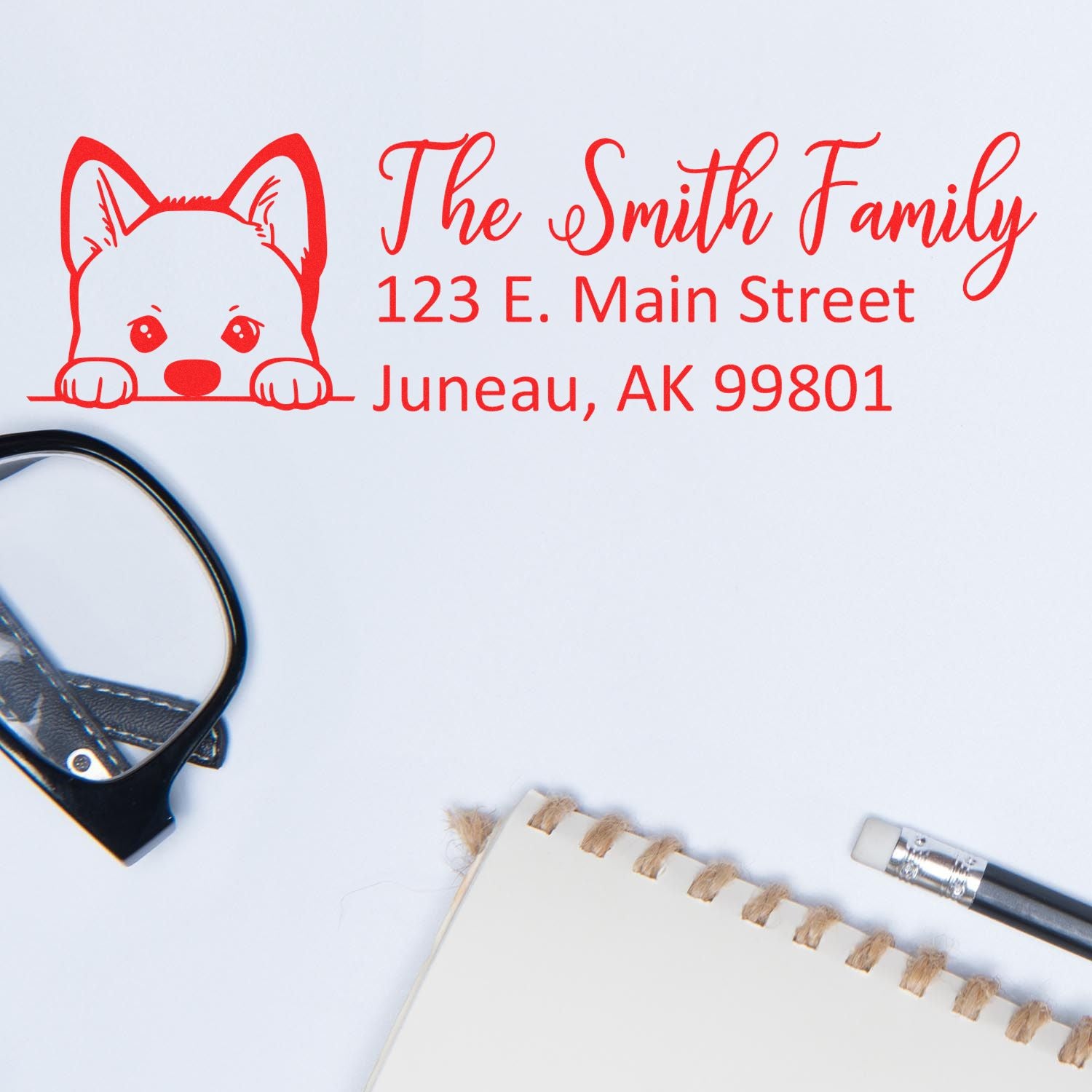 Custom return address rubber stamp for The Smith Family with dog icon and Juneau, AK address.
