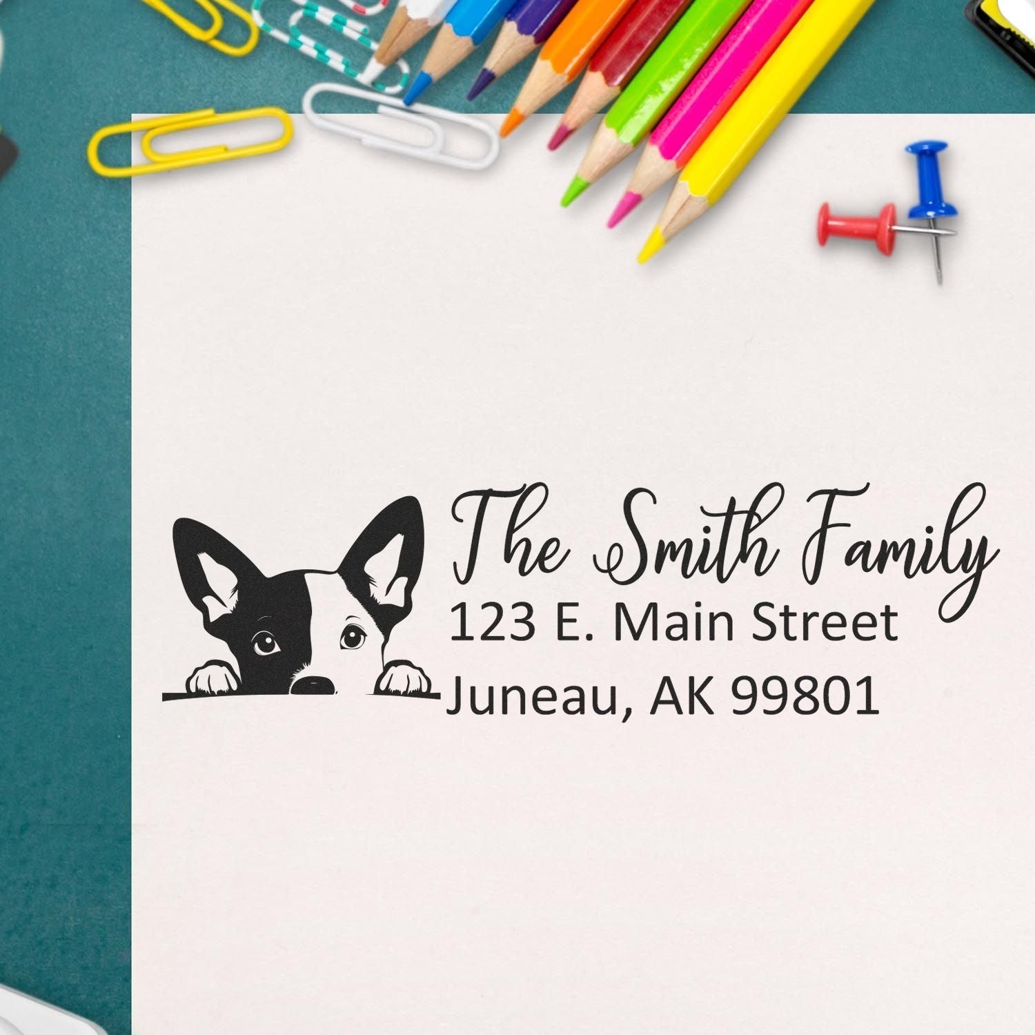 Custom rubber stamp return address with dog illustration for The Smith Family, Juneau, AK 99801.