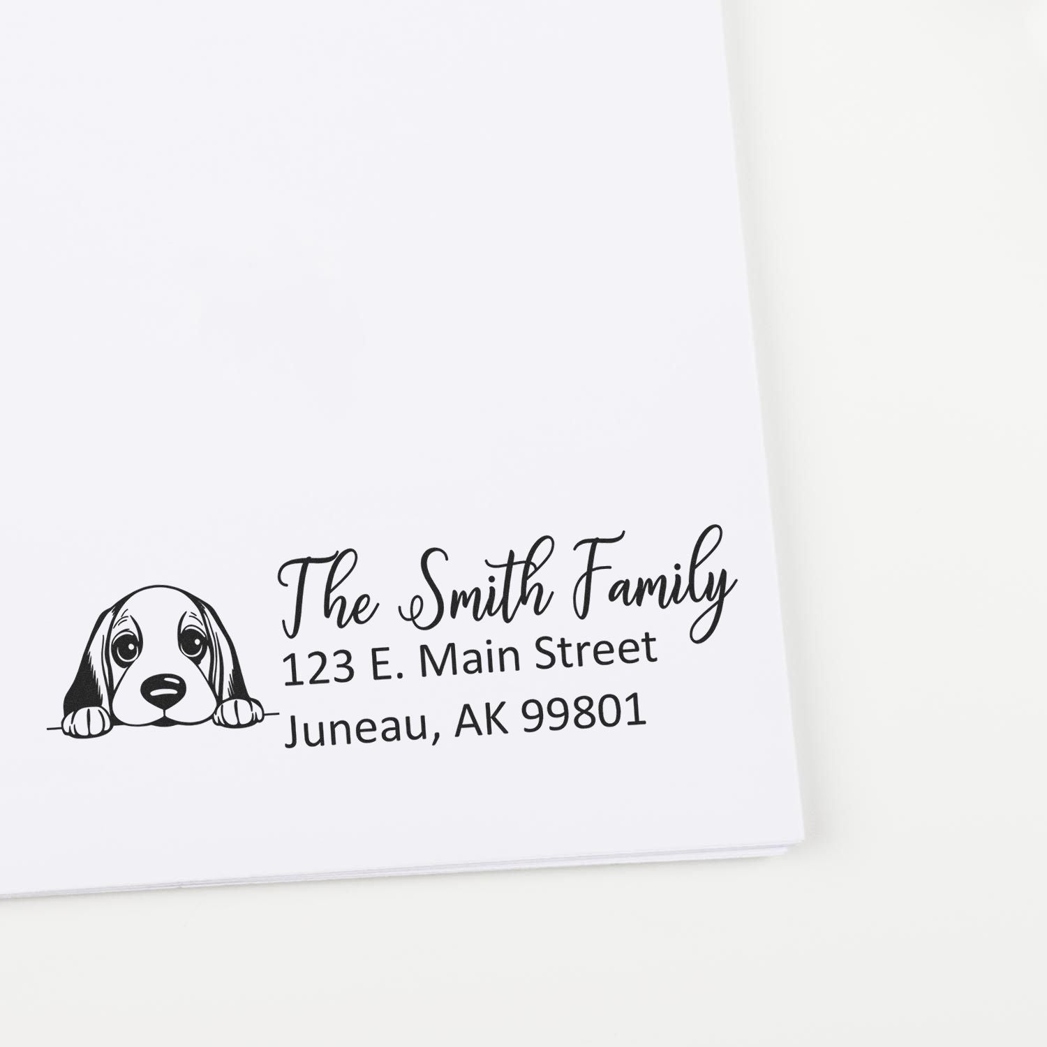 Personalized dog return address rubber stamp for The Smith Family, with street address and Juneau, AK 99801.