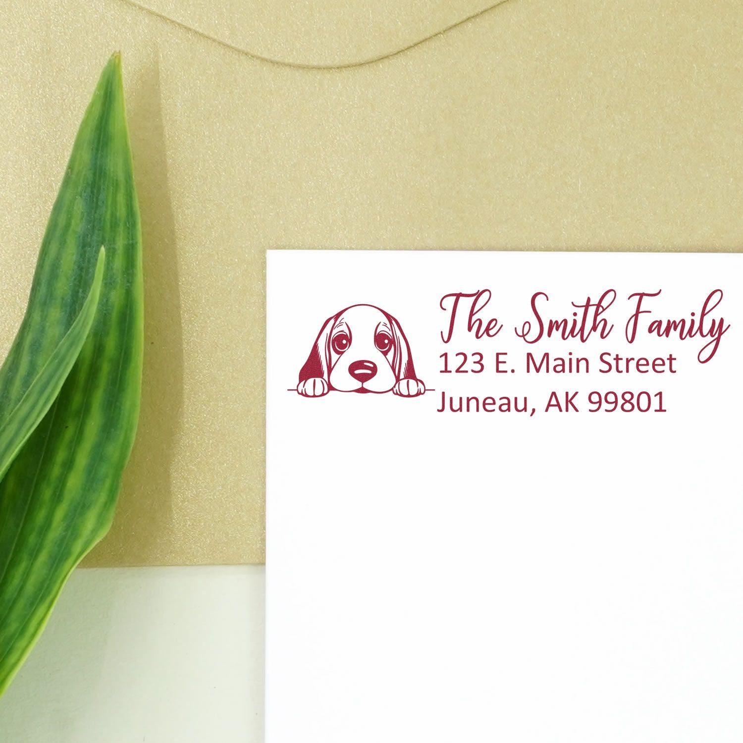 Personalized dog return address rubber stamp for The Smith Family, 123 E. Main Street, Juneau, AK 99801.