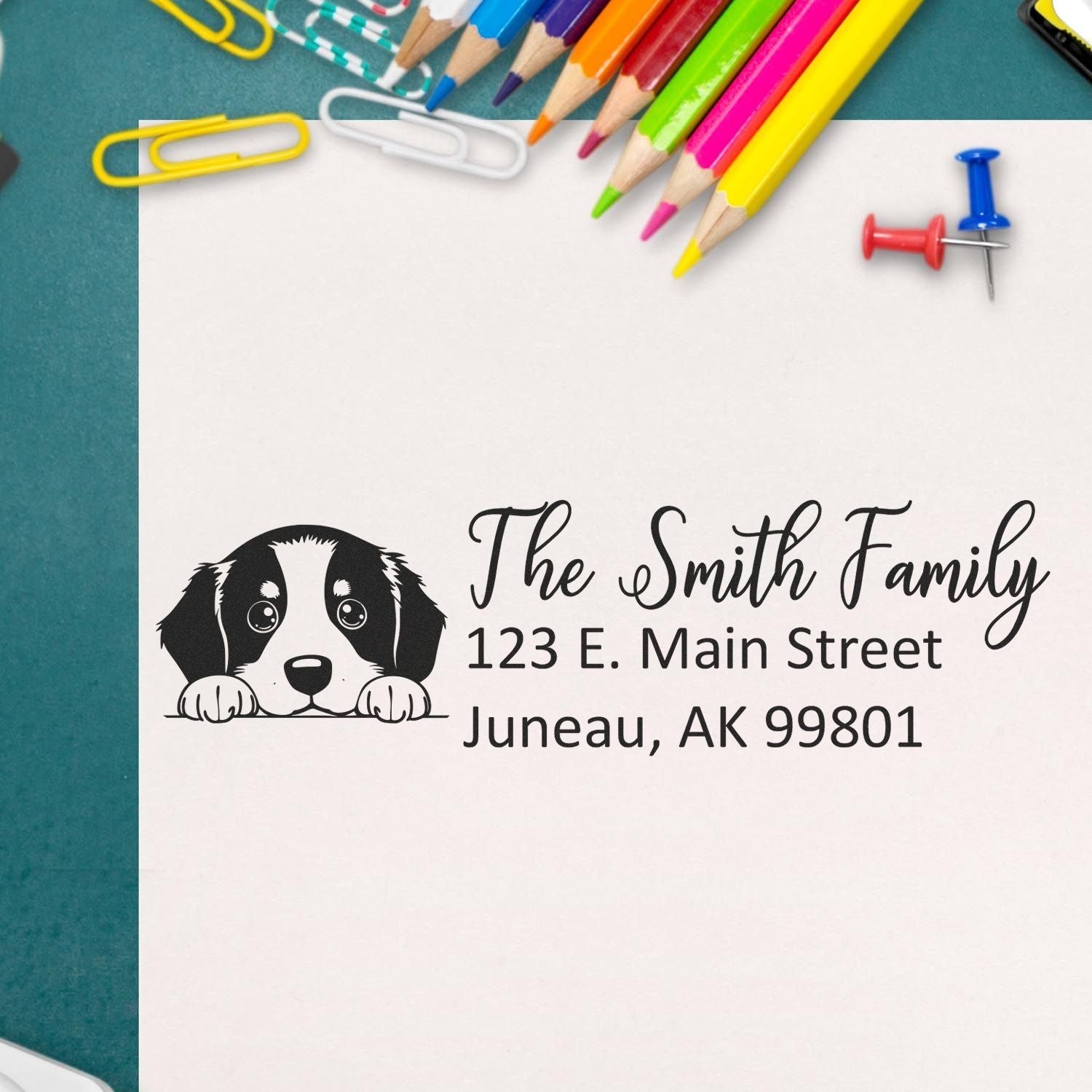 Personalized rubber address stamp with puppy design for The Smith Family, Juneau, AK mailing envelopes.
