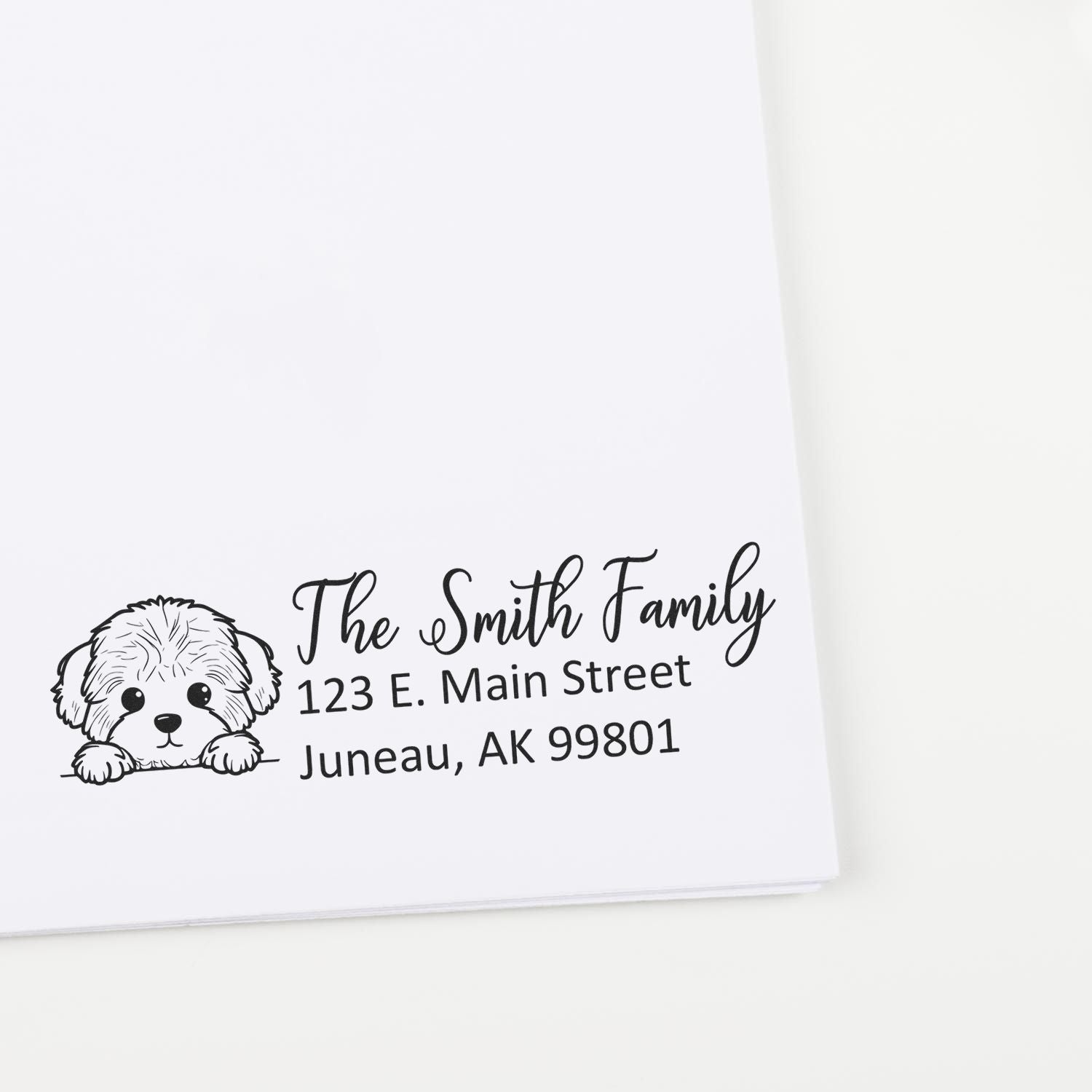 Personalized family address rubber stamp with dog illustration for The Smith Family, featuring return mailing address in Juneau, AK.