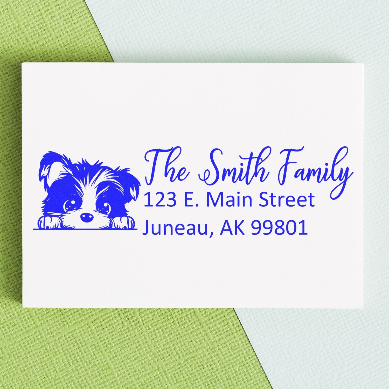 Custom rubber stamp return address with puppy illustration for The Smith Family, Juneau, AK.