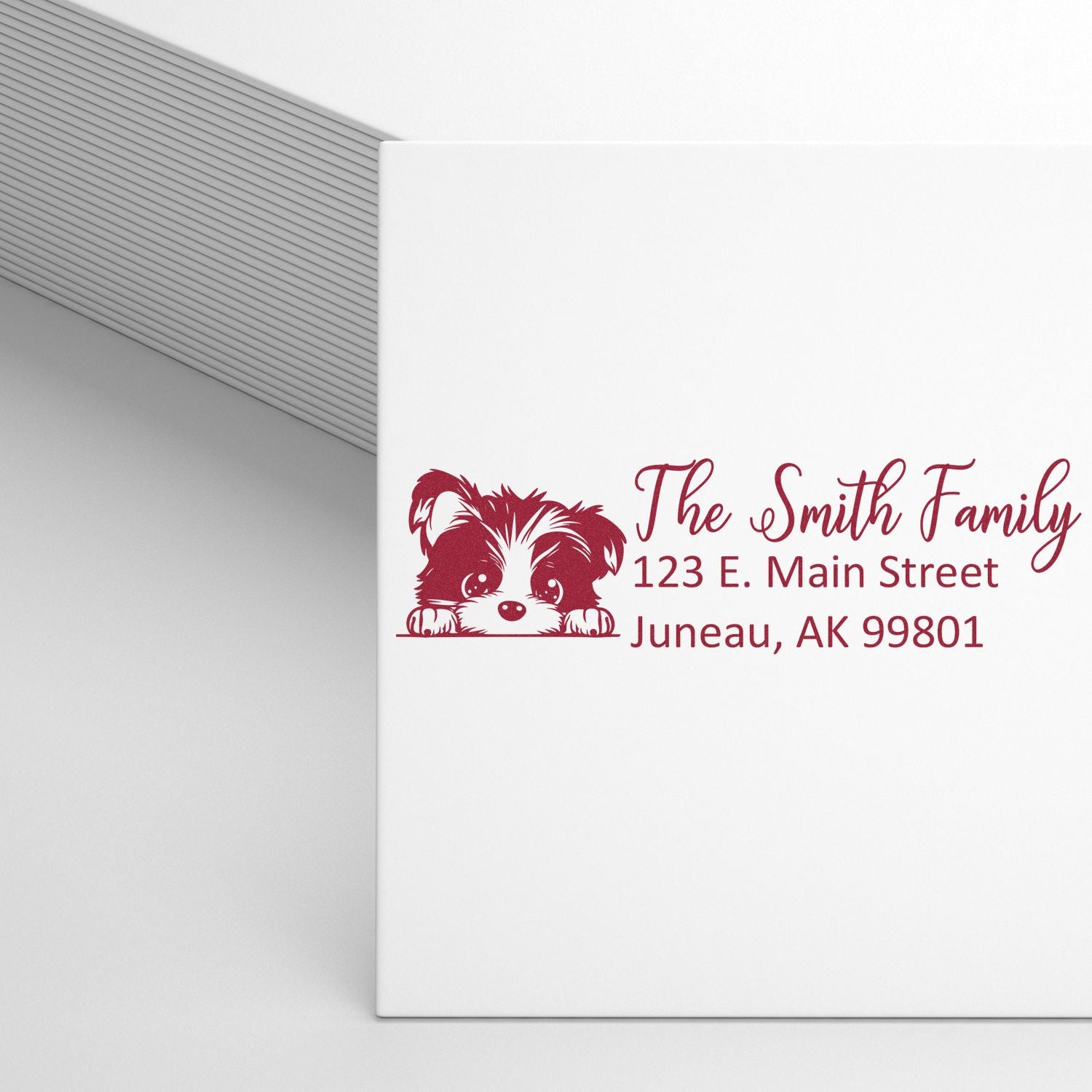 Custom dog return address rubber stamp for The Smith Family, featuring a playful puppy design and Juneau, AK address.
