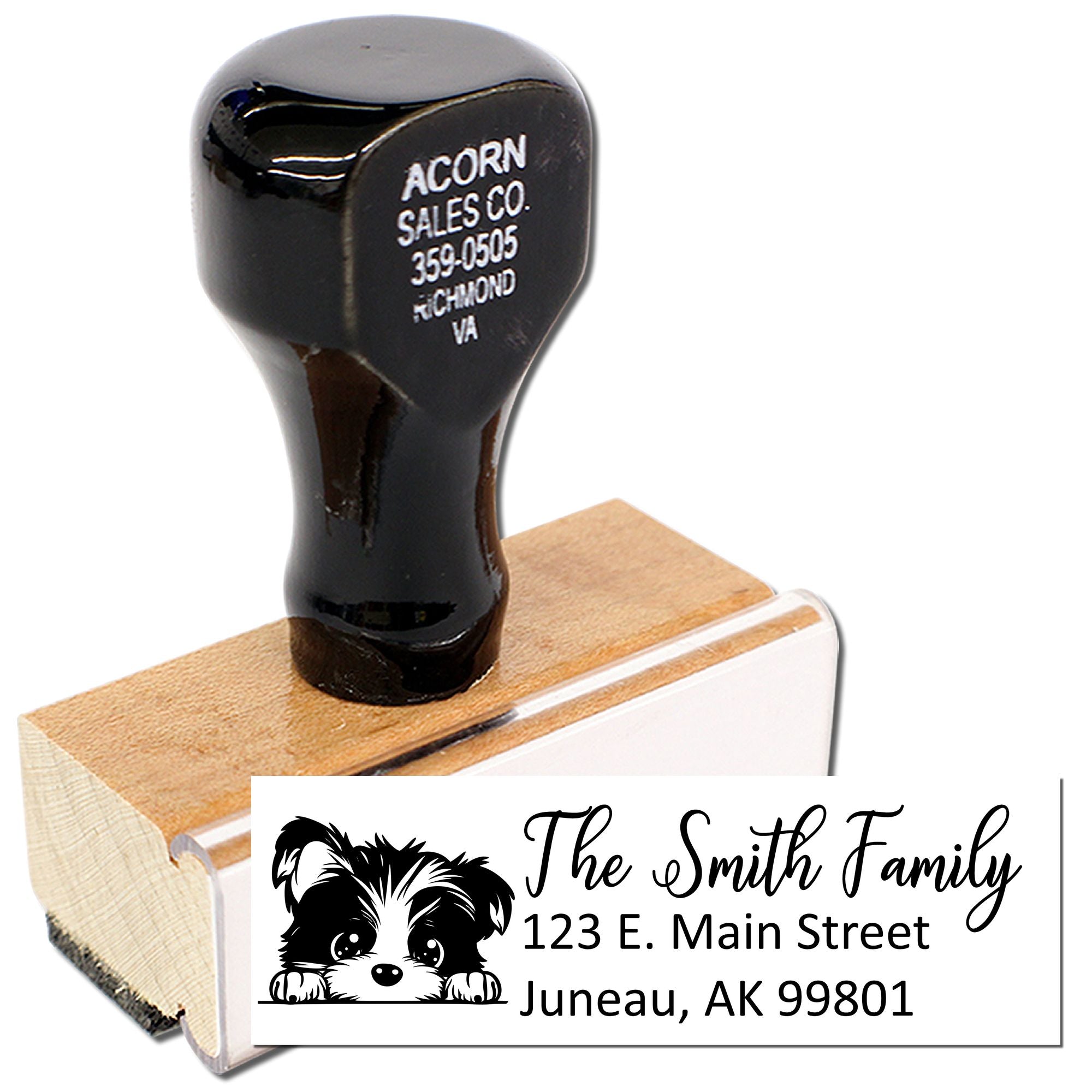 Custom address rubber stamp with dog graphic, showing personalized family return address for mailing and labels.