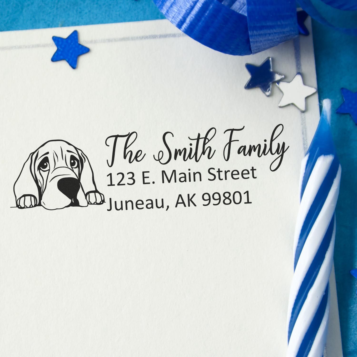 Personalized return address rubber stamp with dog illustration for The Smith Family, Juneau, AK envelope.