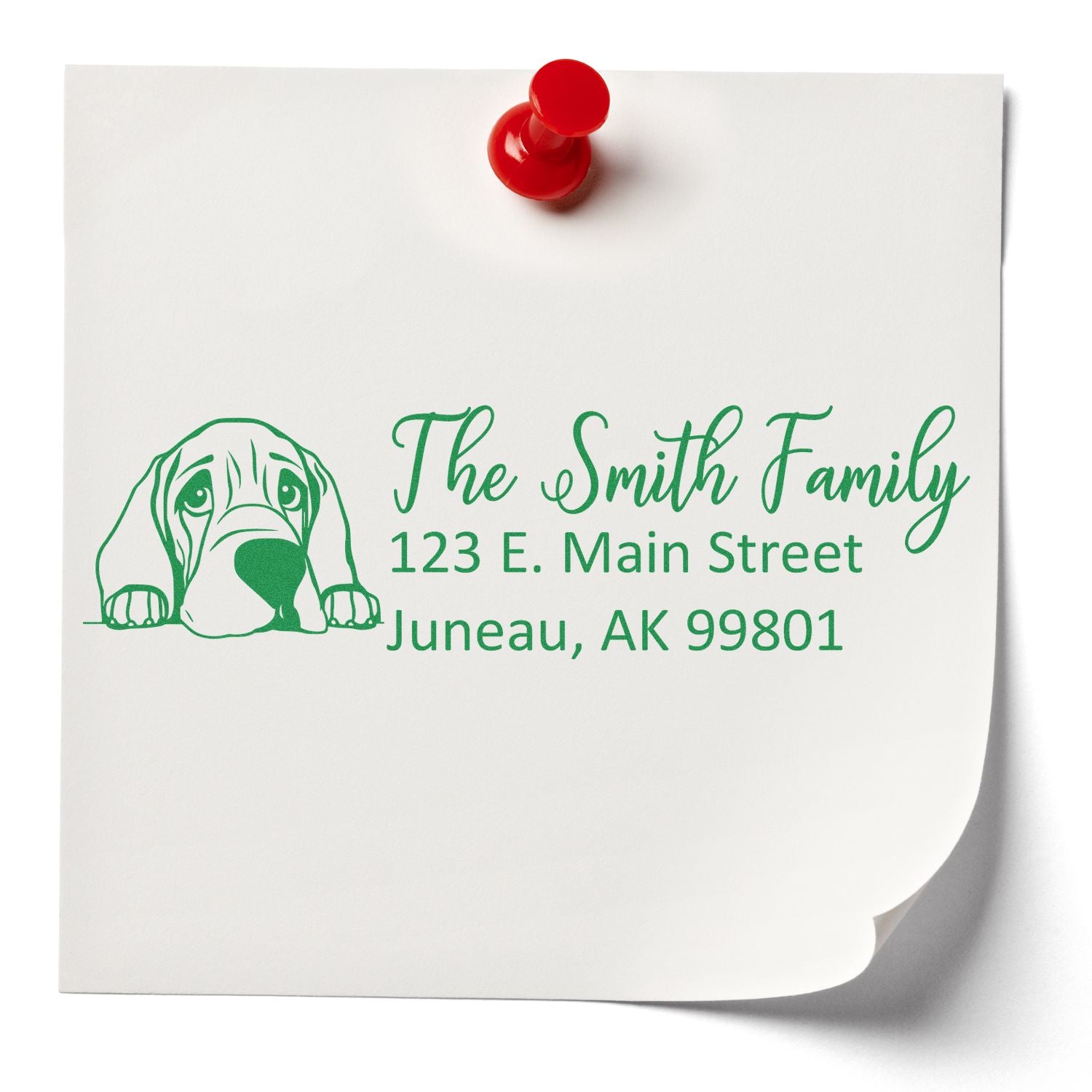Custom rubber return address stamp with dog illustration for The Smith Family, Juneau, AK.