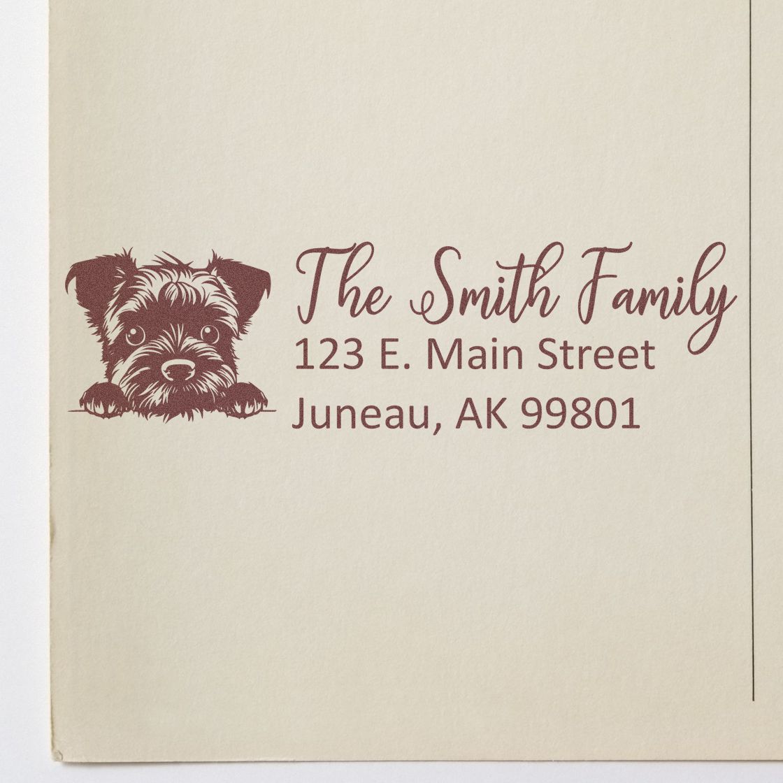 Custom rubber address stamp with puppy design for The Smith Family, featuring name and Juneau, AK return address.