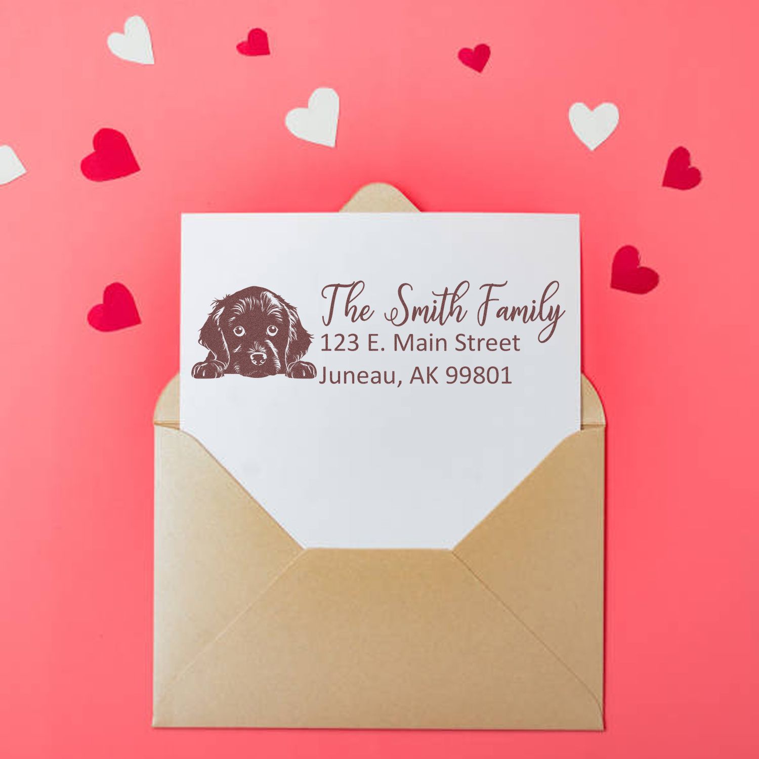Custom rubber stamp return address with dog illustration on envelope, featuring The Smith Family in a romantic heart-themed design.