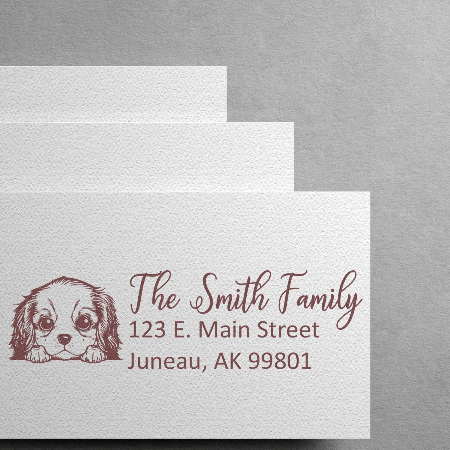 Custom return address rubber stamp with puppy design for The Smith Family, 123 E. Main Street, Juneau, AK 99801