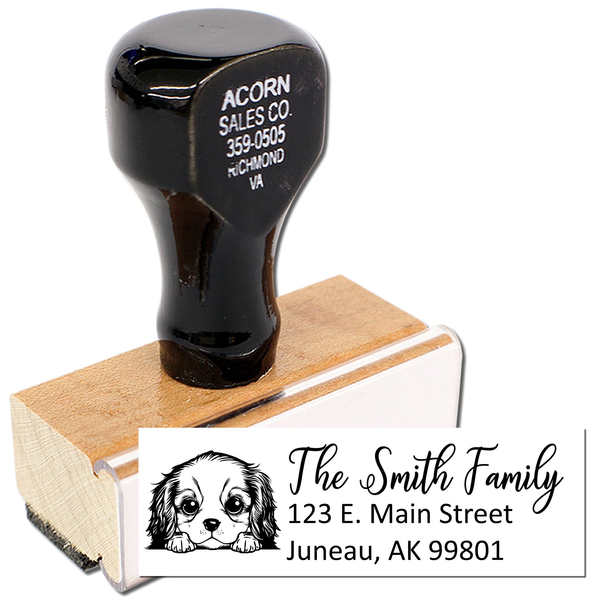 Custom self-inking rubber address stamp with dog design, showing The Smith Family return address imprint for Juneau, AK.