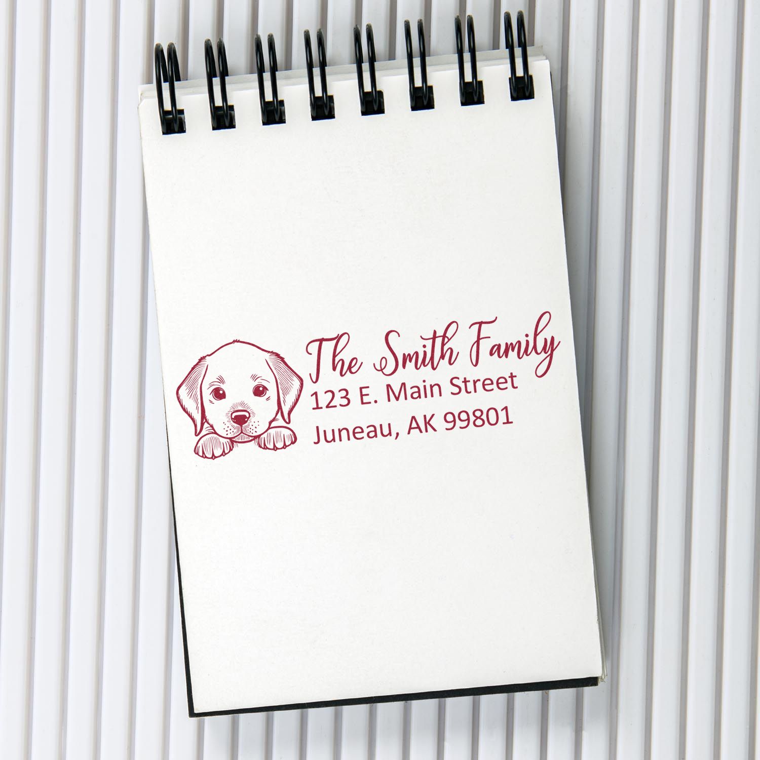 Custom rubber address stamp with puppy design and family return address for The Smith Family, Juneau, AK.