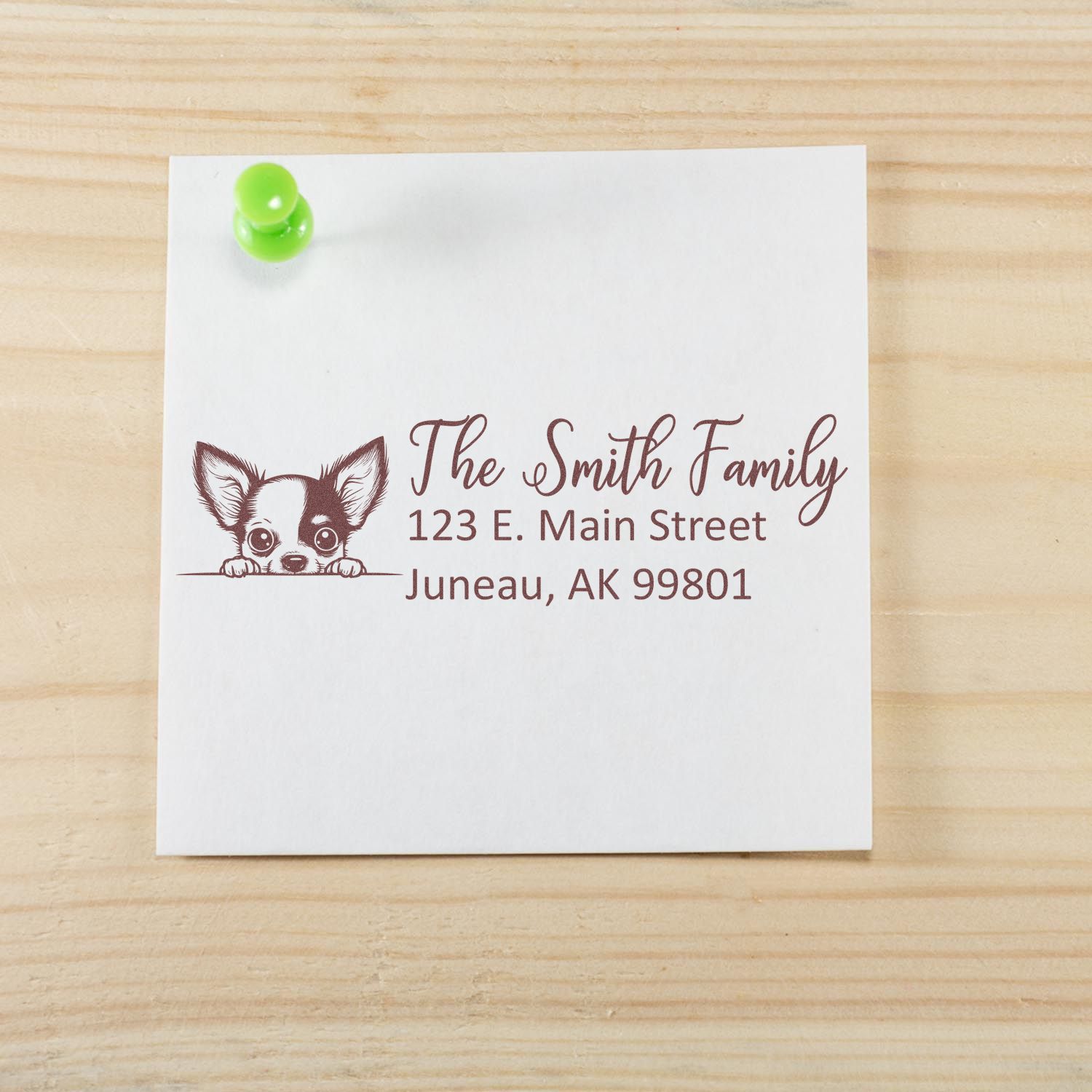 Custom rubber address stamp with dog illustration for The Smith Family, 123 E. Main Street, Juneau, AK 99801.