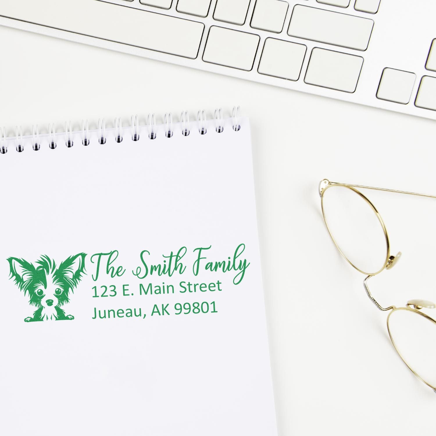 Custom return address rubber stamp with dog logo on notebook, ideal for personalized family stationery.